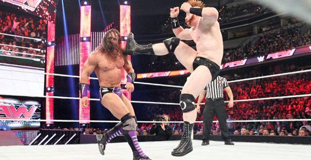 Sheamus delivers the Brogue Kick to Neville