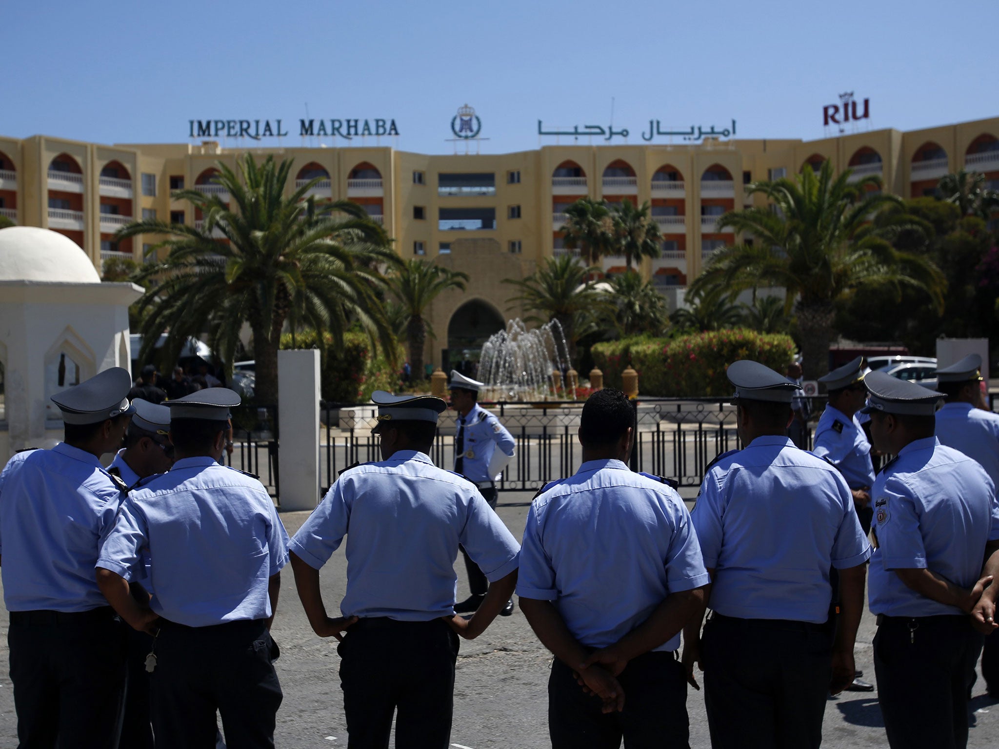 Tunisian police officers guard Imperial Marhaba hotel during visit of top security officials of Britain, France, Germany and Belgium in Sousse, Tunisia, Monday, June 29, 2015