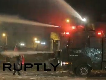 Riot police use water cannons on Chile fans celebrating Copa America semi-final win