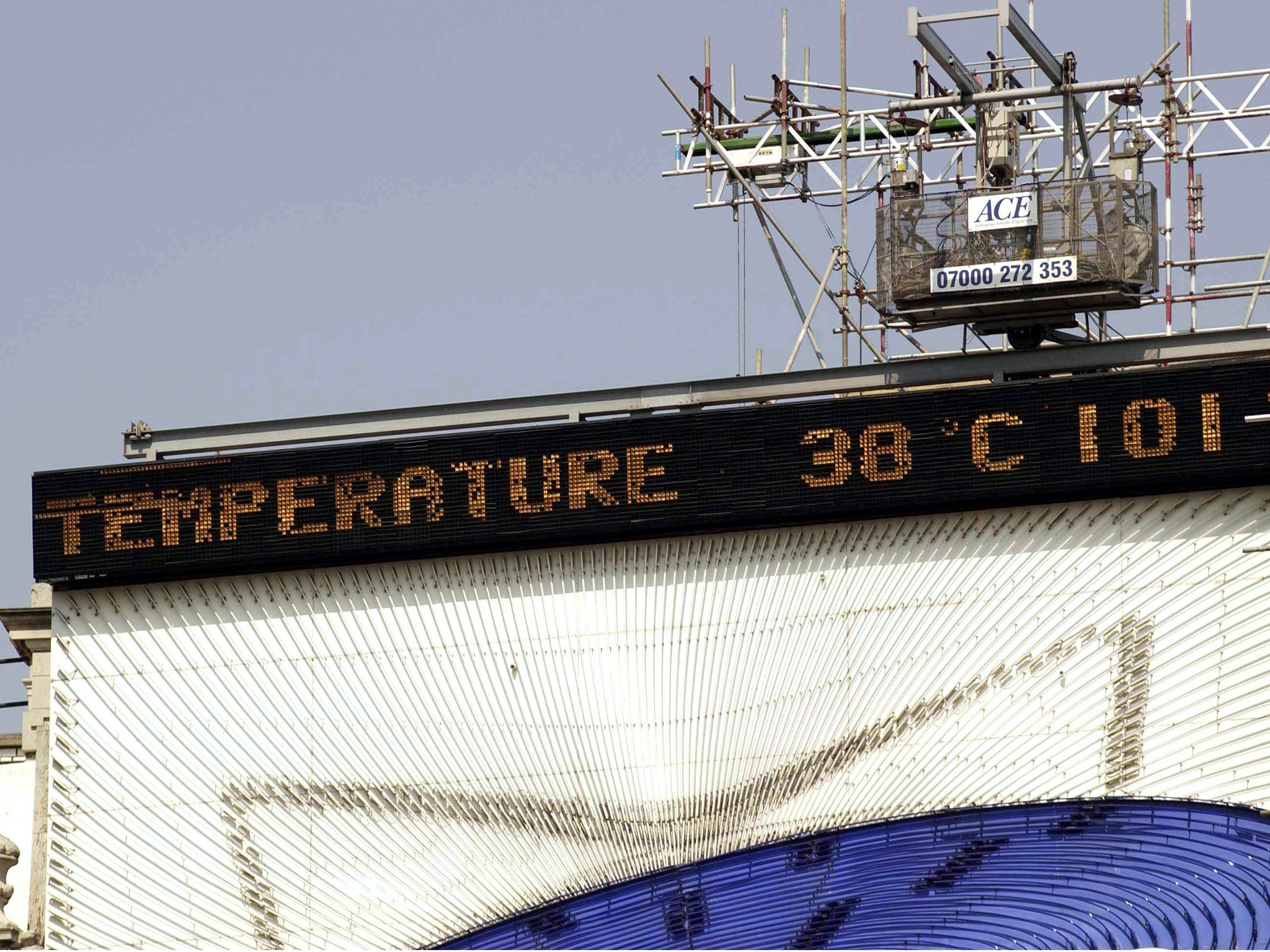 Electronic temperature sign in Piccadilly shows 38 degrees Centigrade and 101 degrees Fahrenheit on 10 Aug 2003