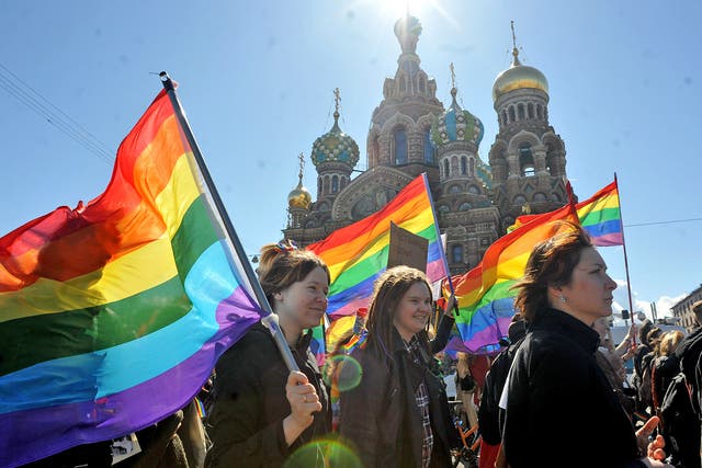 Gay rights activists march in Russia, where 'gay propaganda' was outlawed in 2013