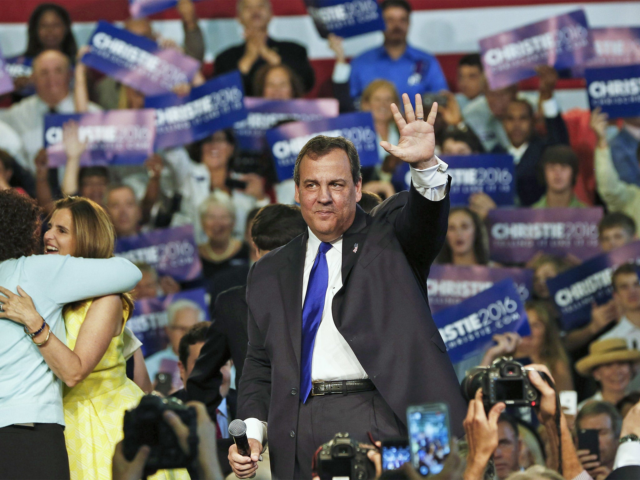 Chris Christie waves to supporters at the announcement of his candidacy for the Republican presidential nomination, in Livingston, New Jersey