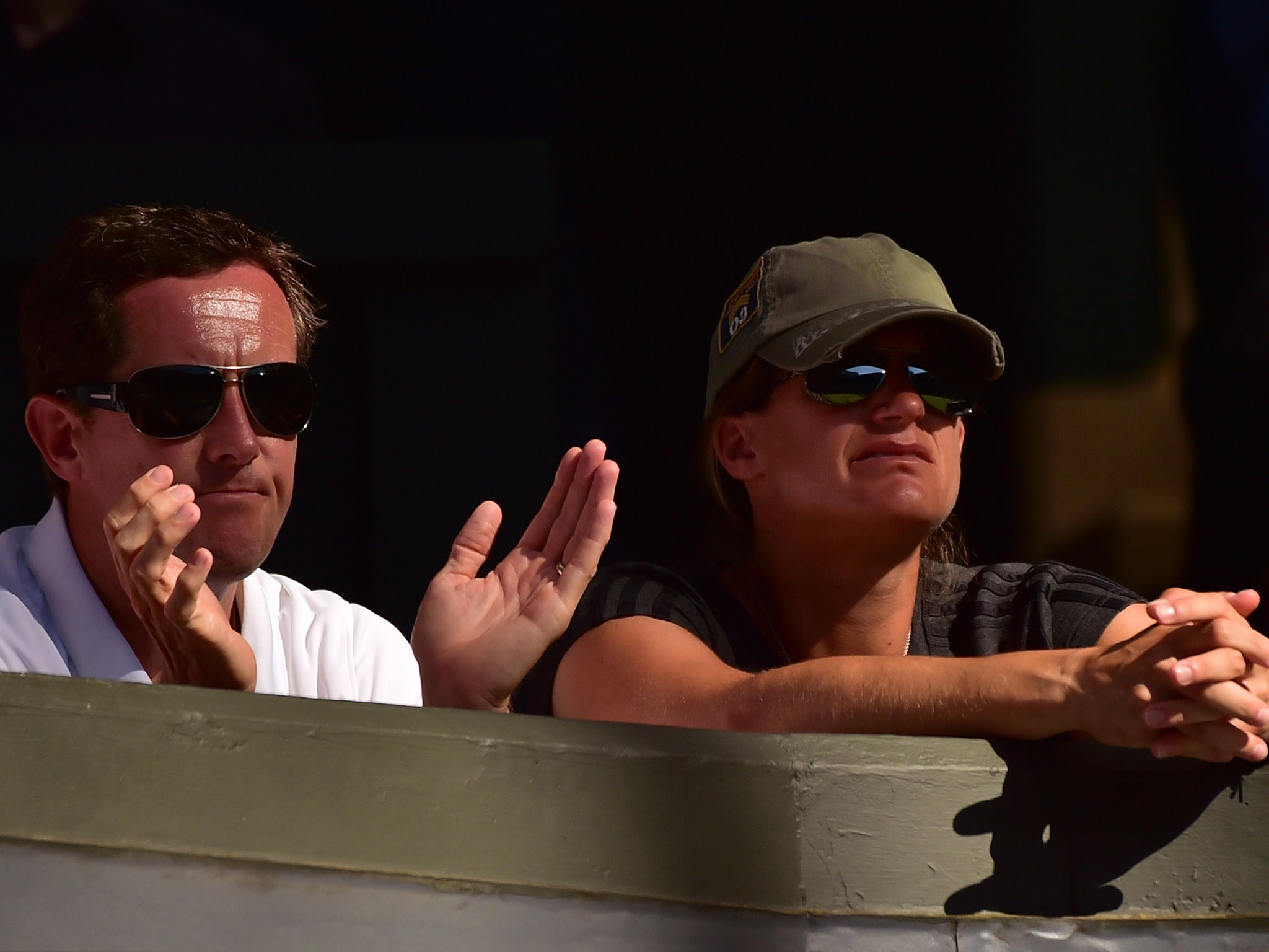 Murray's coaches Amelie Mauresmo and Jonas Bjorkman watch the action