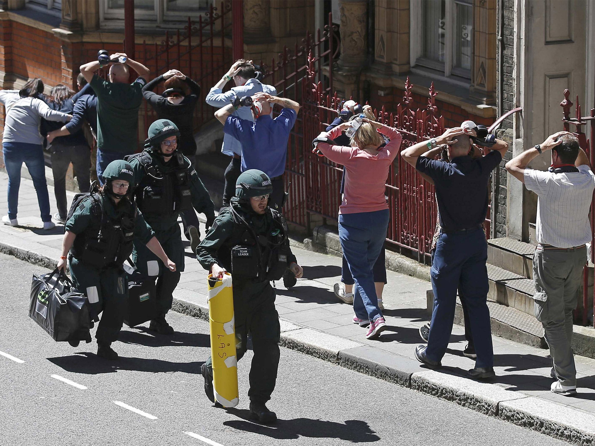 Emergency services run as they take part in Exercise Strong Tower, at the scene of a mock terror attack at a disused underground station in central London