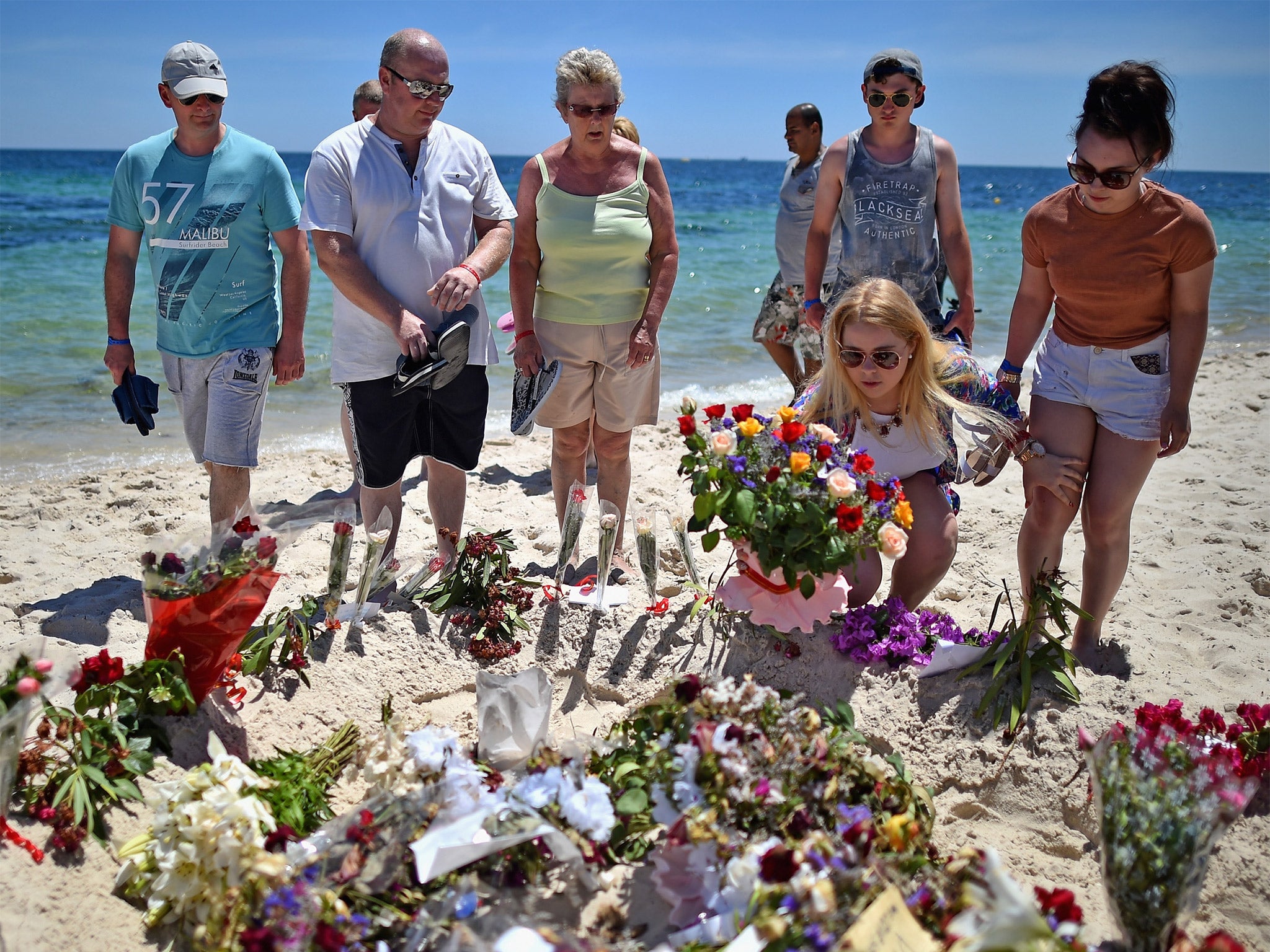 Holidaymakers lay flowers on Marhaba beach (Getty)
