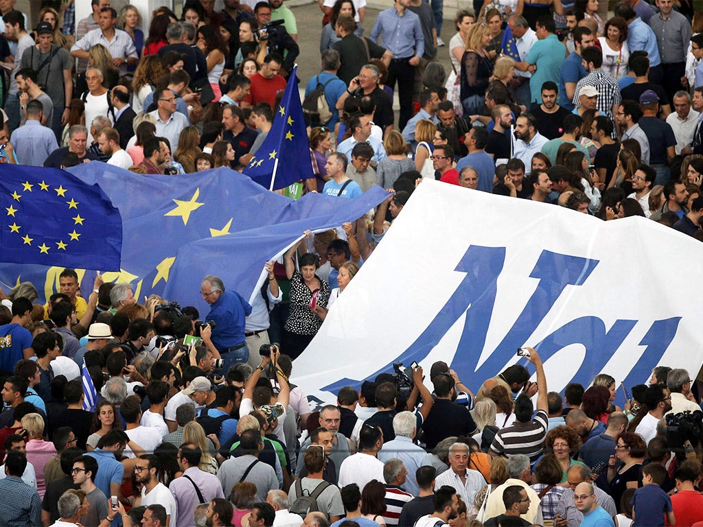 The word 'Yes' in Greek is seen on a banner during a pro-Euro rally in front of the parliament building, in Athens on Tuesday