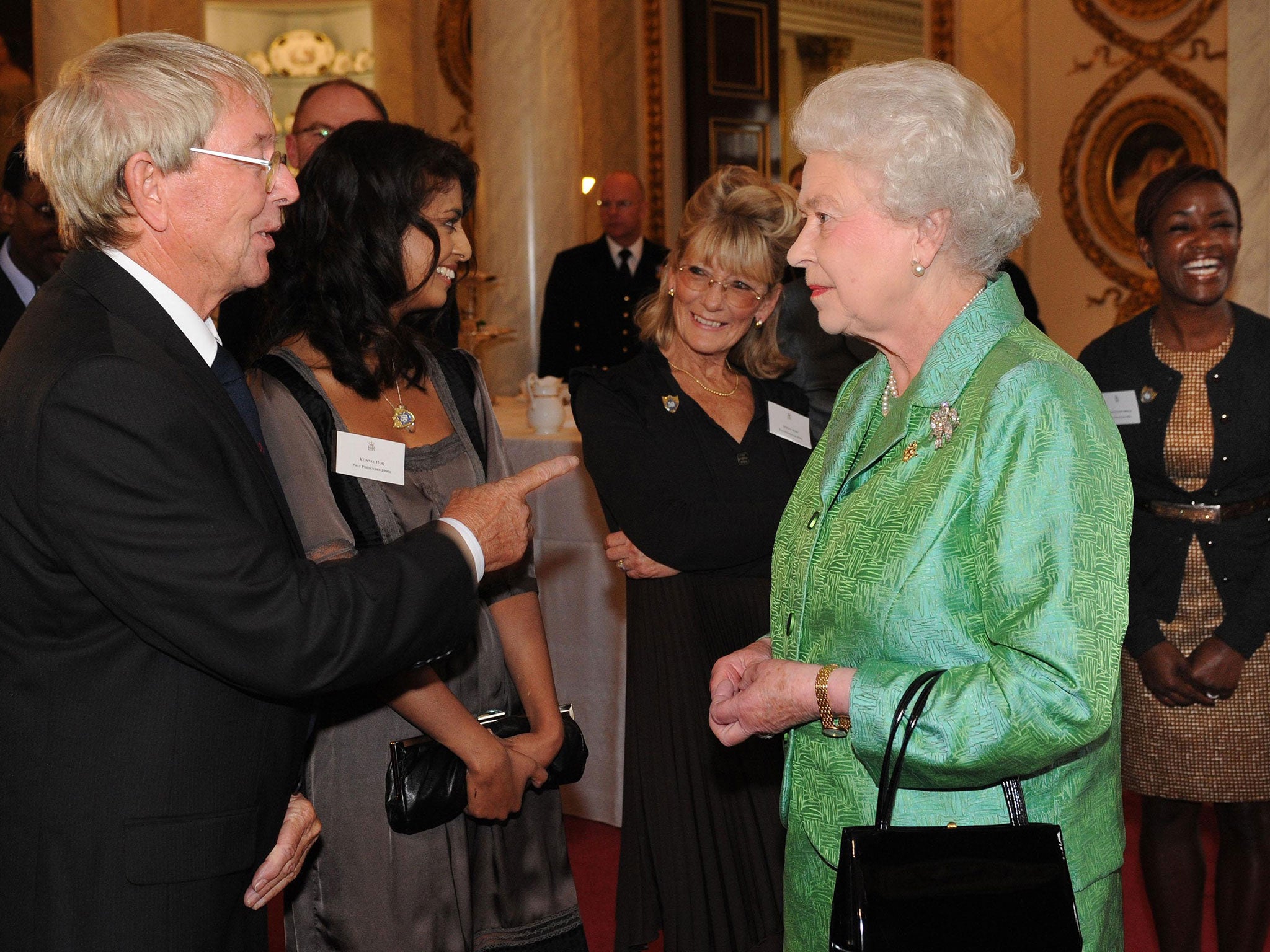 Queen Elizabeth II receiving Blue Peter presenter John Noakes