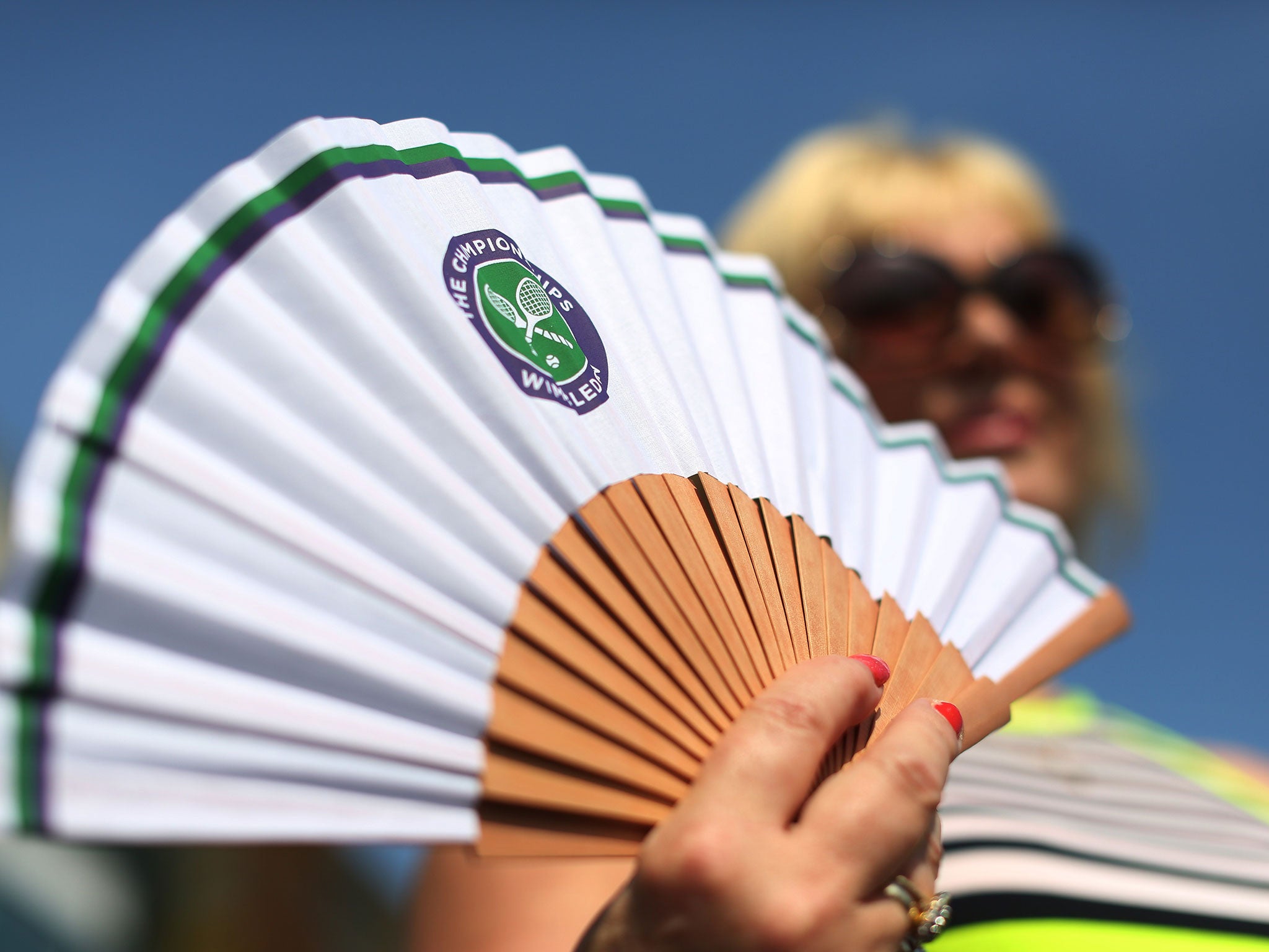 The fan is a more necessary accessory at this year's Wimbledon than most