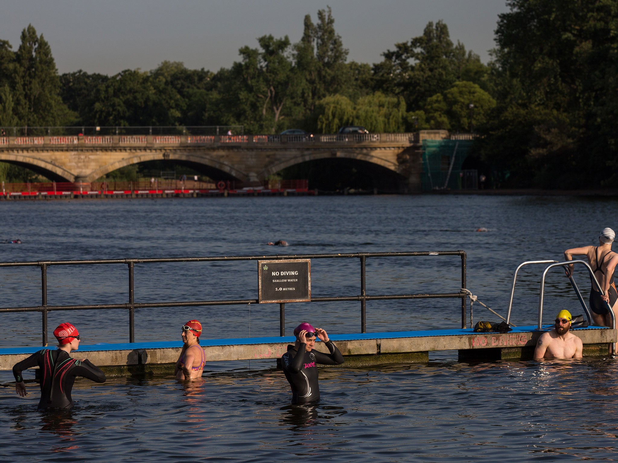 Londoner's take an early morning dip in the Serpentine