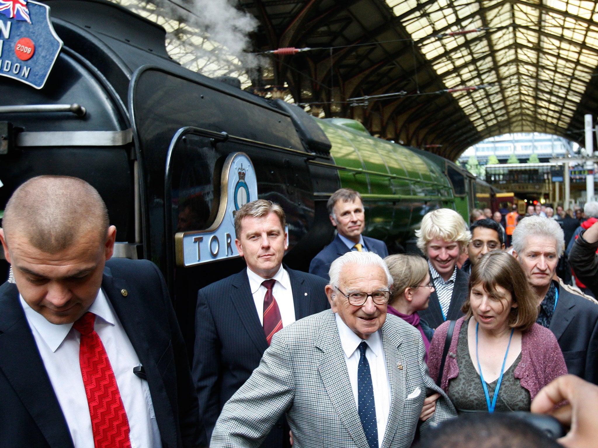 Nicholas Winton, centre, who organized the Winton Train rescue of children 70 years ago at Liverpool Street station