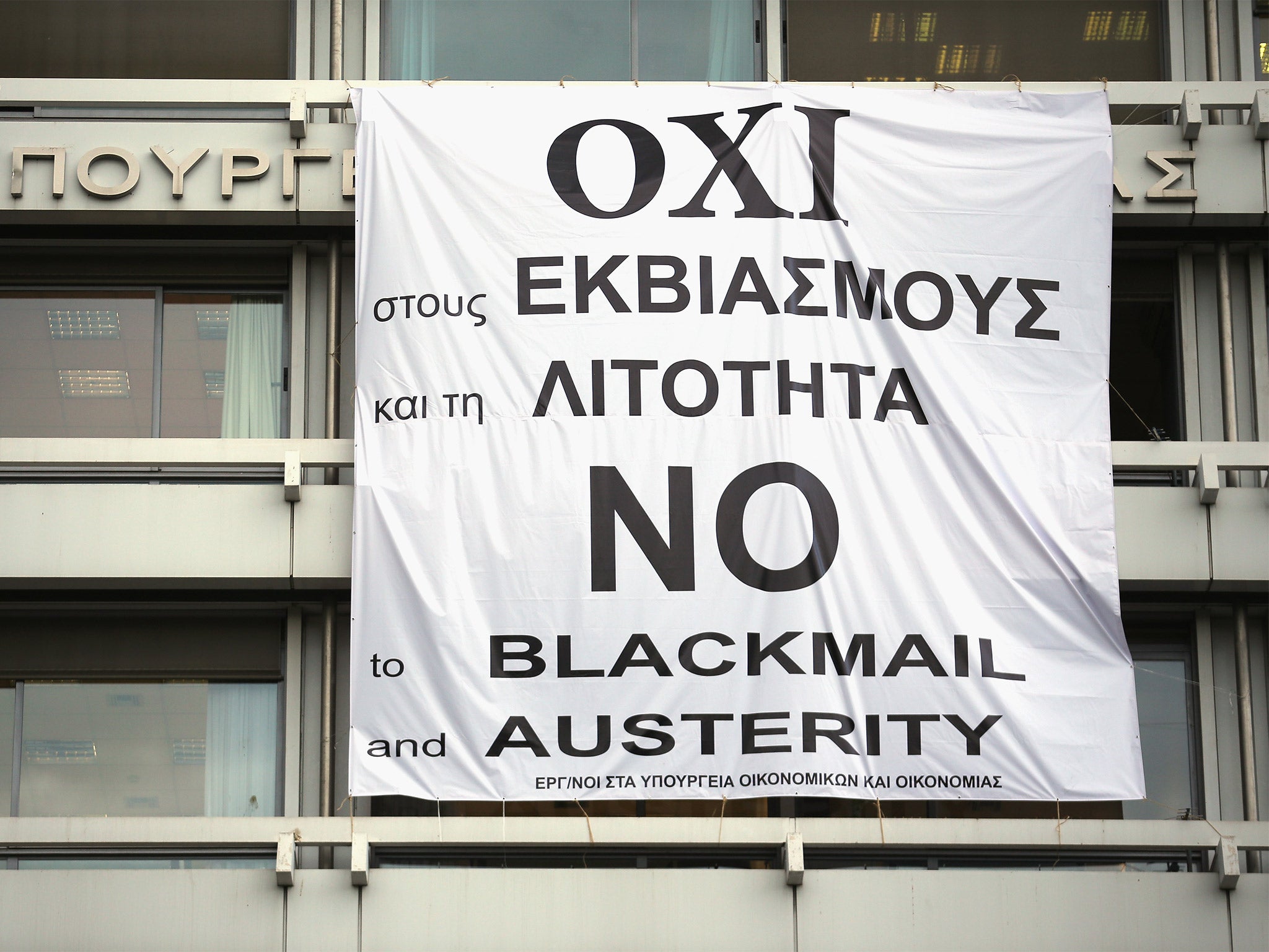A banner supporting the NO vote in the upcoming referendum hangs from the offices of the Greek Finance Ministry