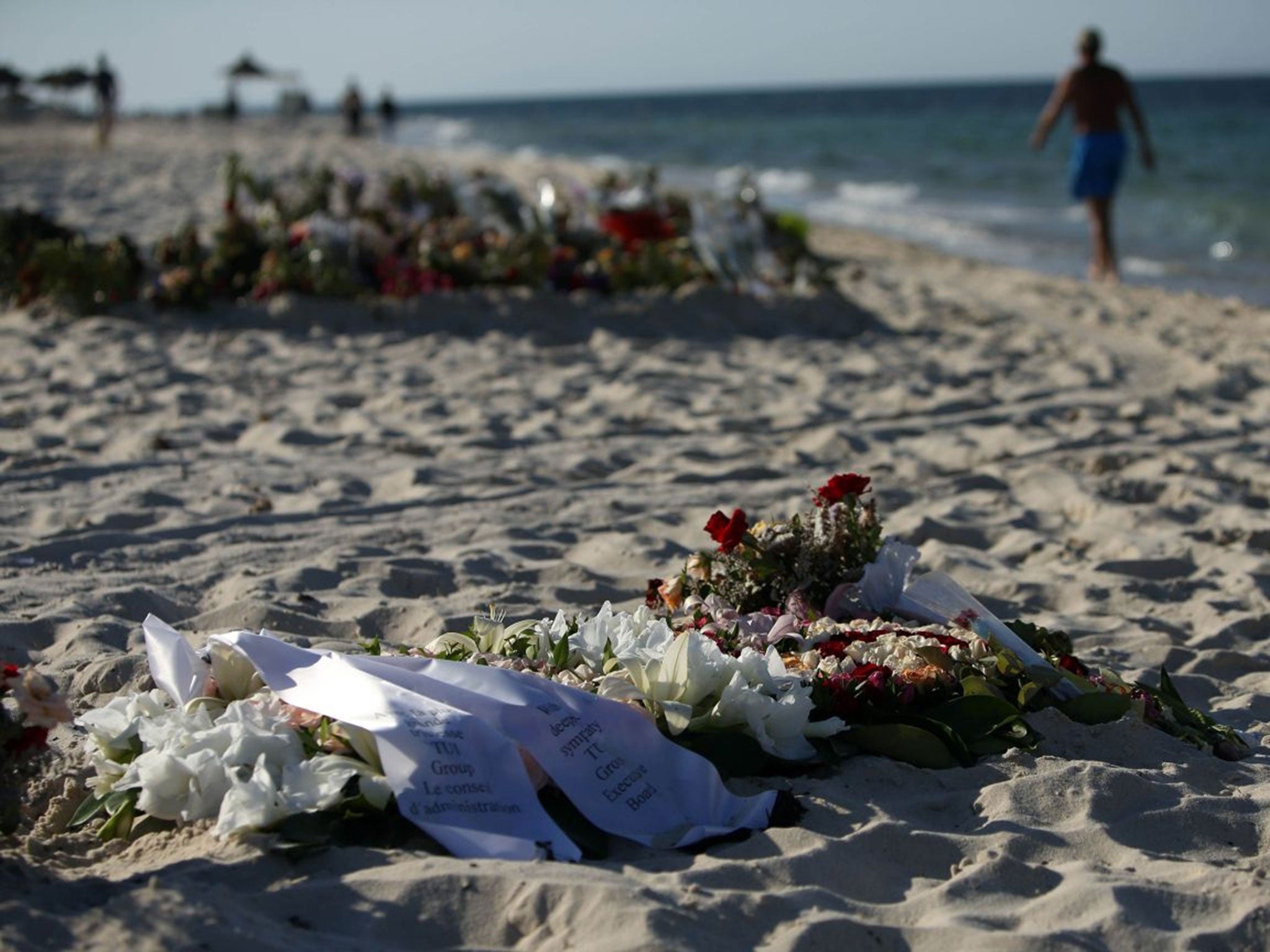 Tributes lie on the beach near the RIU Imperial Marhaba hotel in Sousse, Tunisia, following the terror attacks on the beach.