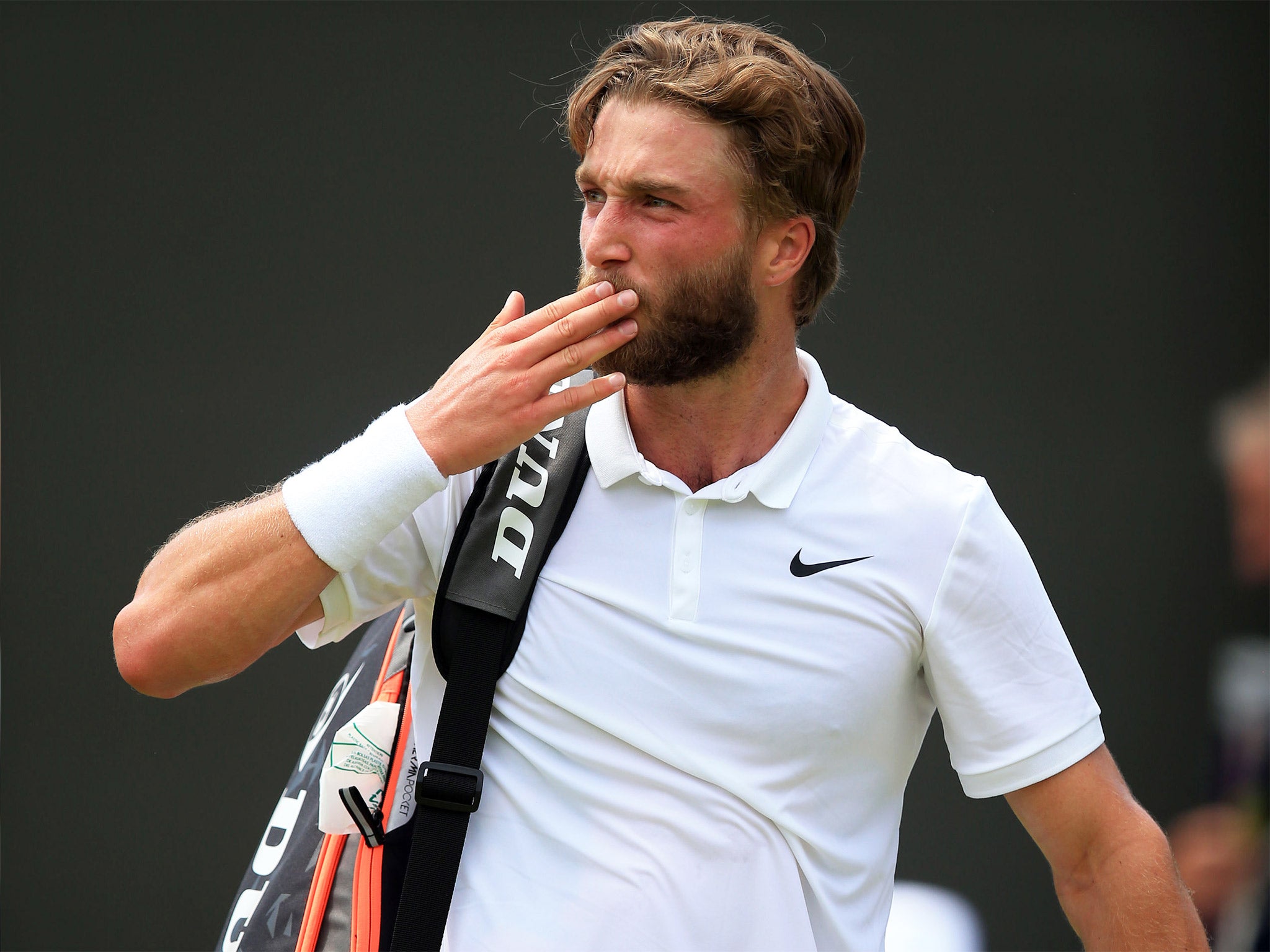 Liam Broady blows kisses to the crowd after his defeat