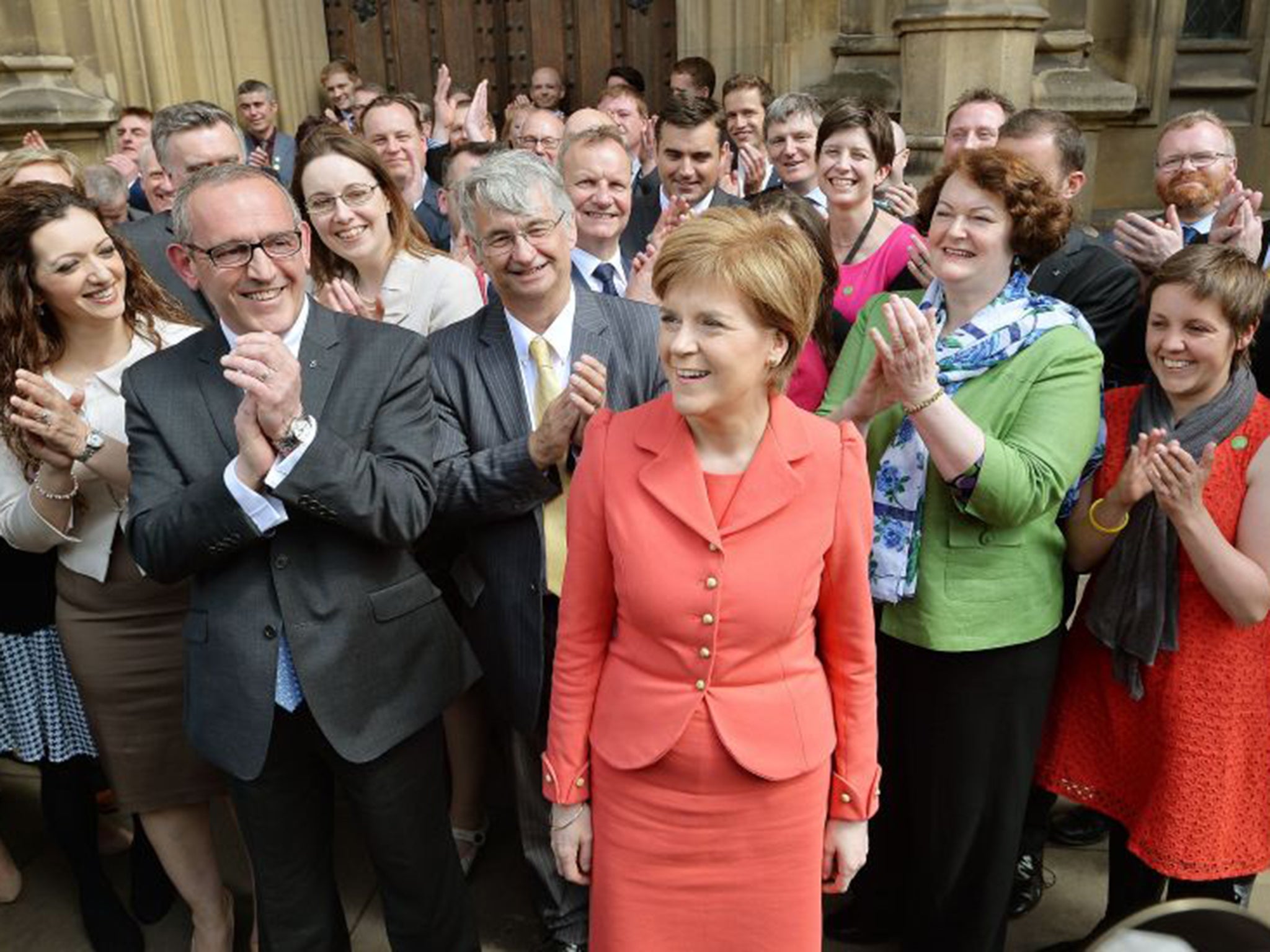 Nicola Sturgeon stands with the SNP’s 56 new MPs – who may be reduced to mere bystanders for the majority of Commons business (PA)