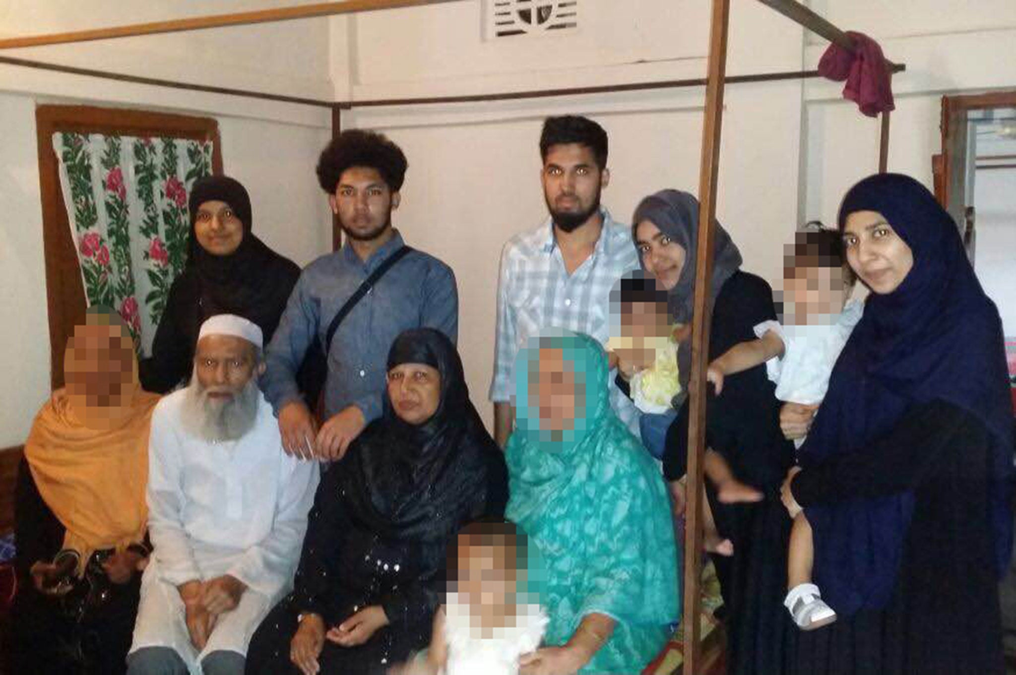 21-year-old Rajia Khanom (back row, far left) was spoken to by police at Heathrow