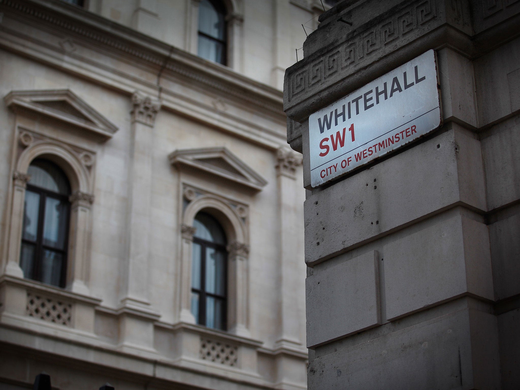 A Whitehall street sign hangs on the corner of Downing Street on July 8, 2010 in London, England. Whitehall is an area of central London, near to Parliament, that is dominated by the great departments of state.