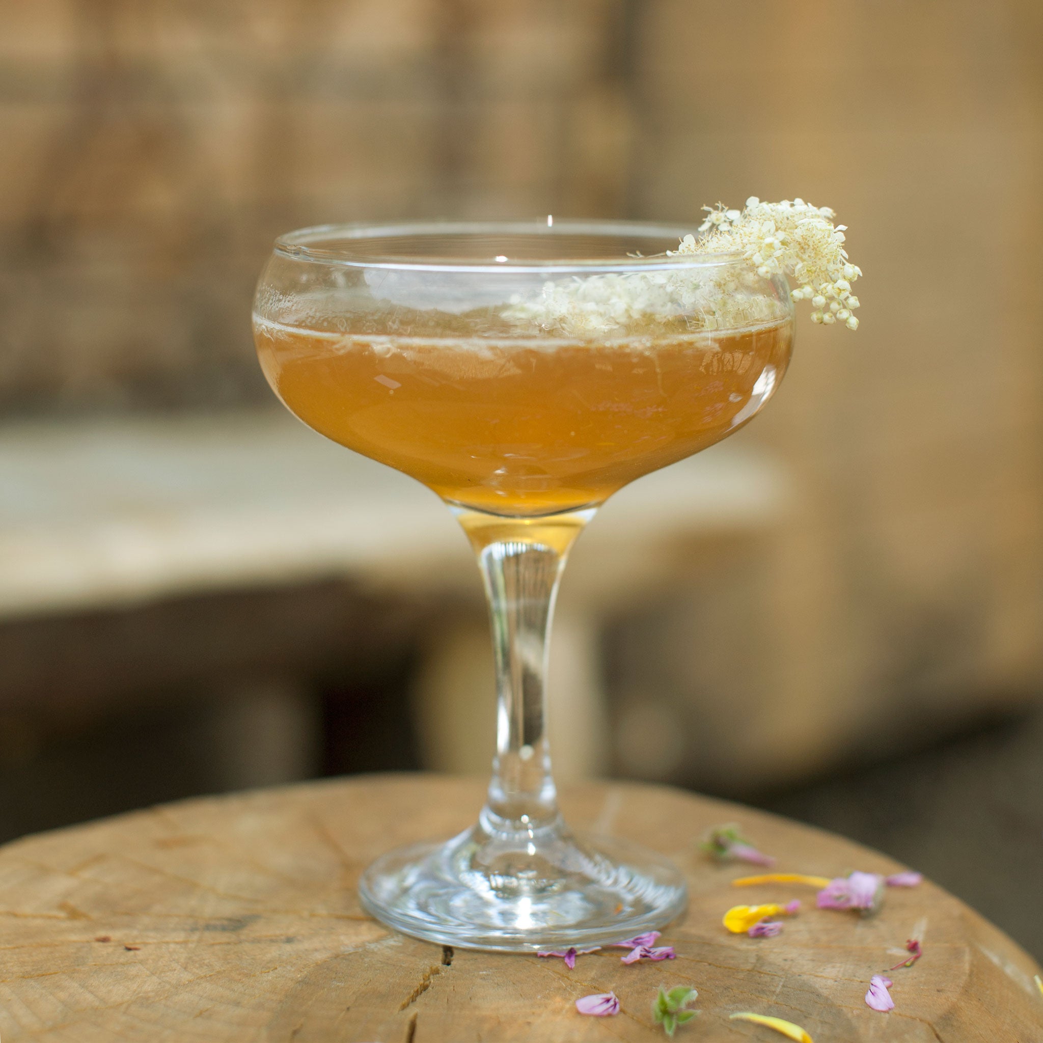 A Mighty Meadowsweet cocktail is made by topping the syrup with cognac, Grand Marnier and orange bitters