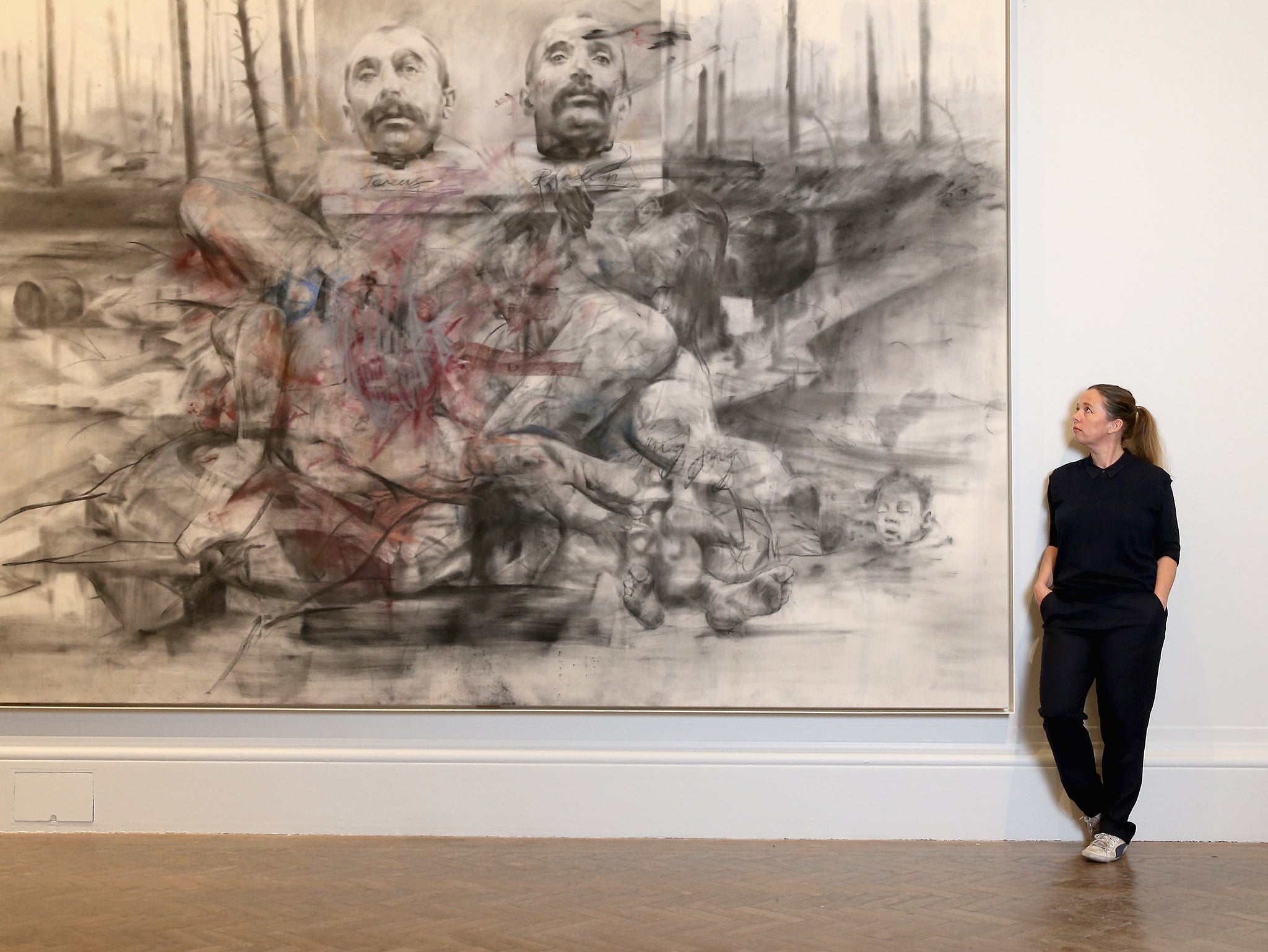 Artist Jenny Saville poses next to one of her works of art as she curates La Peregrina, A response to the Royal Academy's Rubens Exhibition at the Royal Academy of Arts