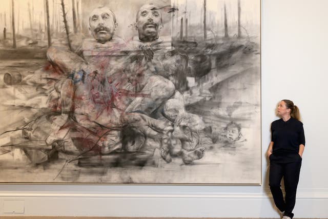 Artist Jenny Saville poses next to one of her works of art as she curates La Peregrina, A response to the Royal Academy's Rubens Exhibition at the Royal Academy of Arts