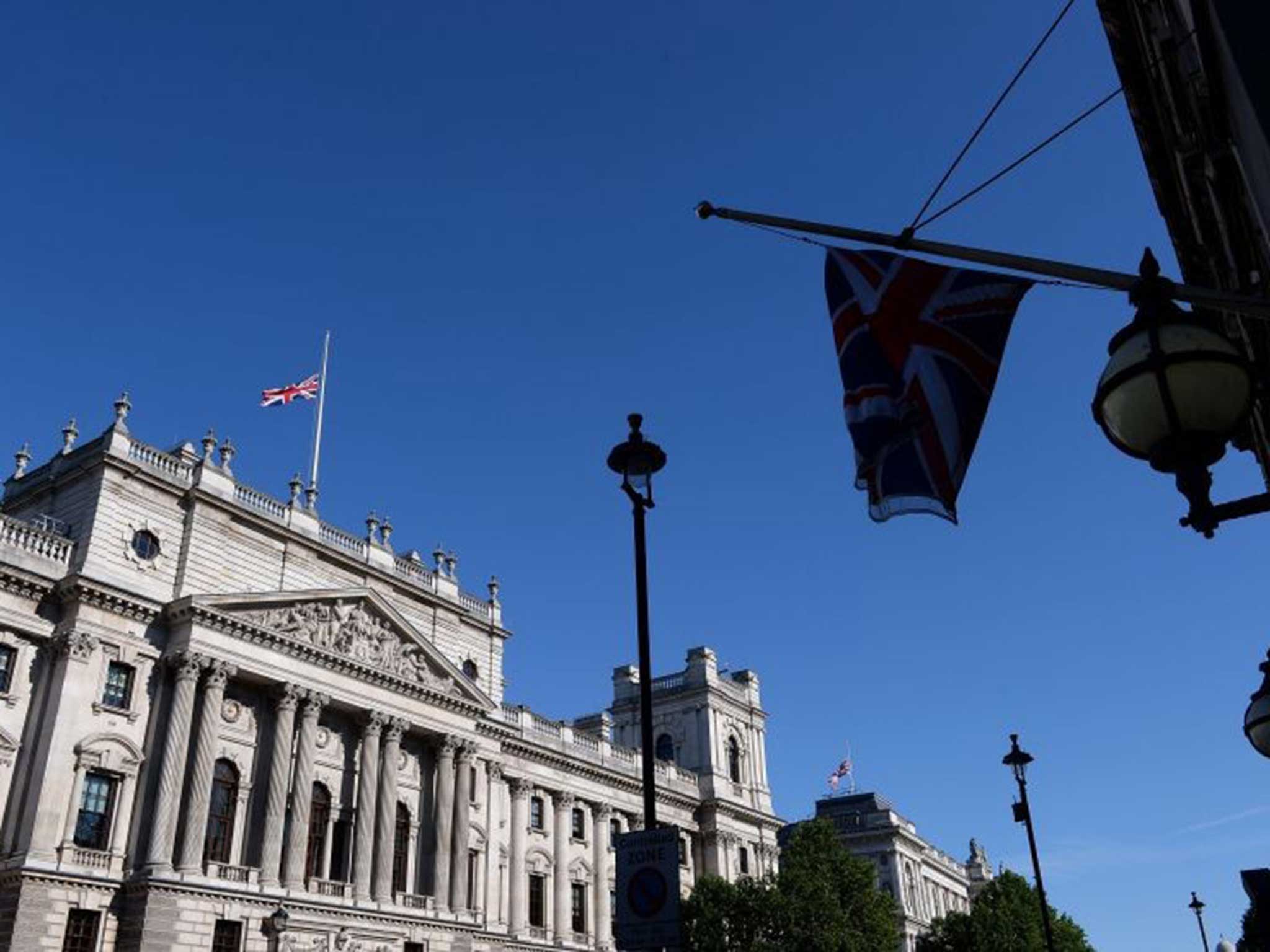 Flags are flown at half mast over Whitehall in memory of the 38 people who died on 2 June