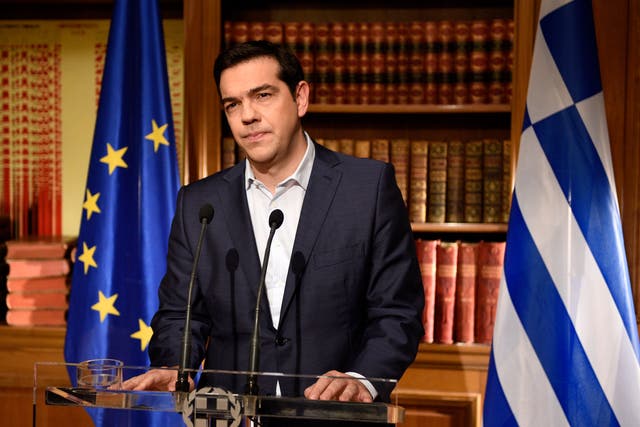 Greek Prime Minister Alexis Tsirpas delivers a televised address to the nation from his office at Maximos Mansion on 1 July 2015 in Athens, Greece