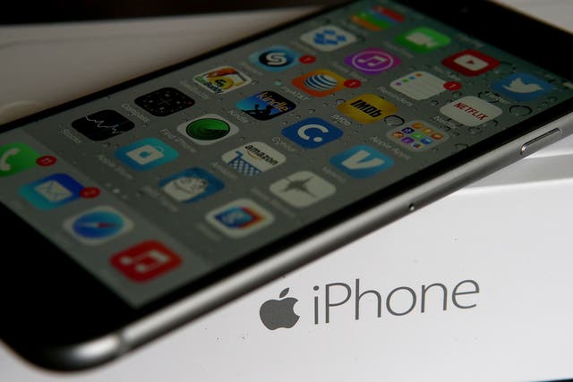 An Apple iPhone sits on a box on January 27, 2015 in San Anselmo, California