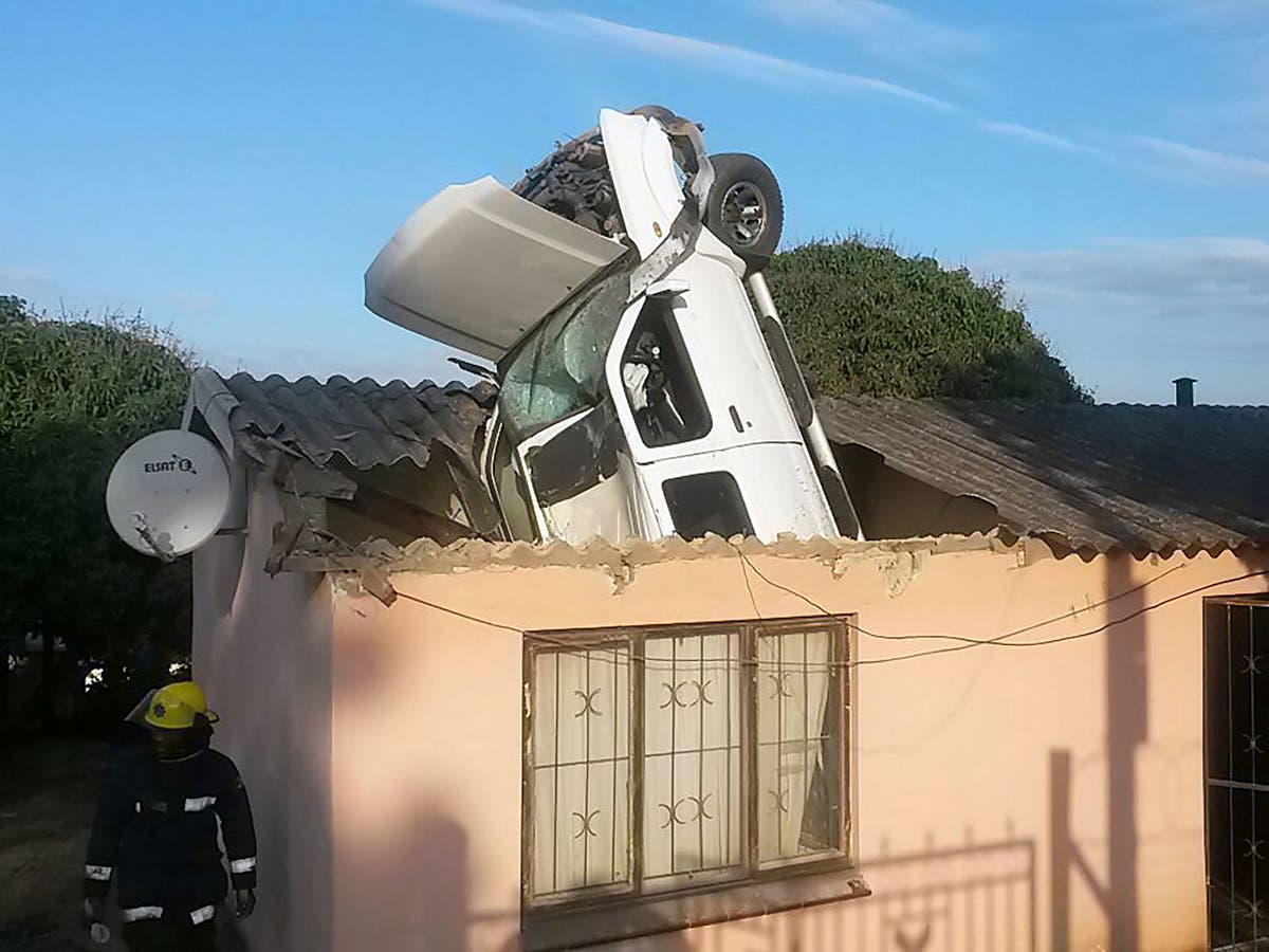Driver Makes A Miraculous Escape After His Car Goes Flying Into The Roof Of A House In Durban 