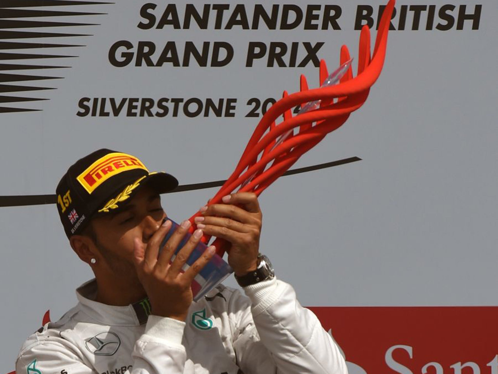 Lewis Hamilton with the Santander trophy after winning last year’s British Grand Prix