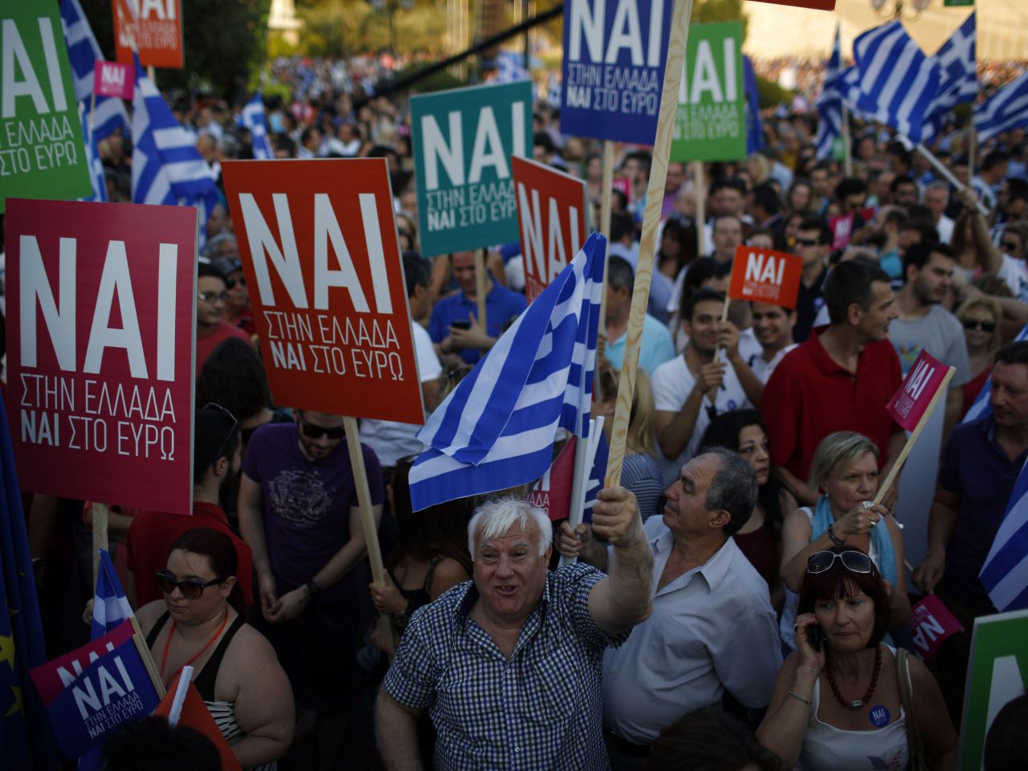 Protesters on both sides of the argument ('No' pictured here) have rallied in Athens