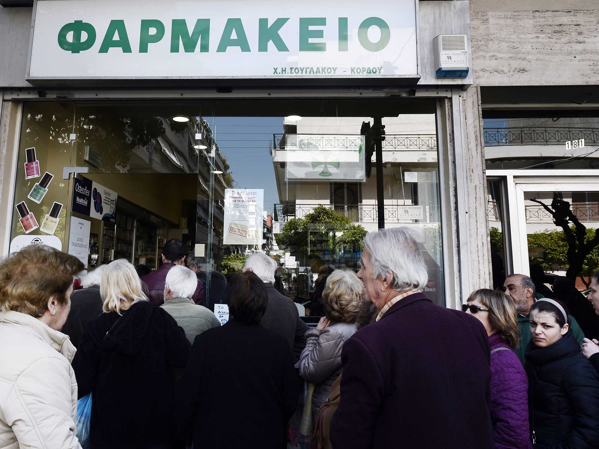 People outside a Greek pharmacy last year