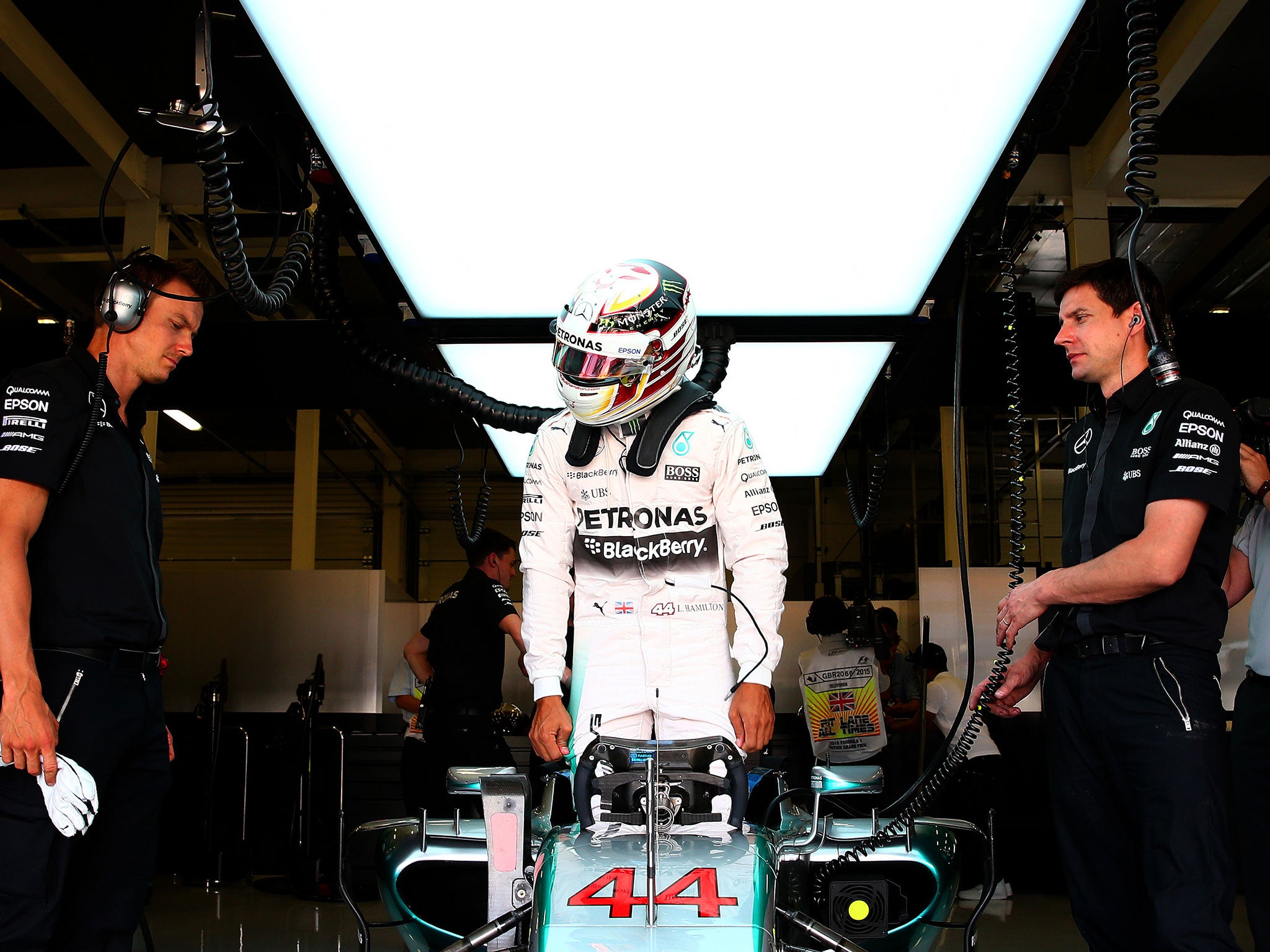 Lewis Hamilton climbs into his Mercedes W05