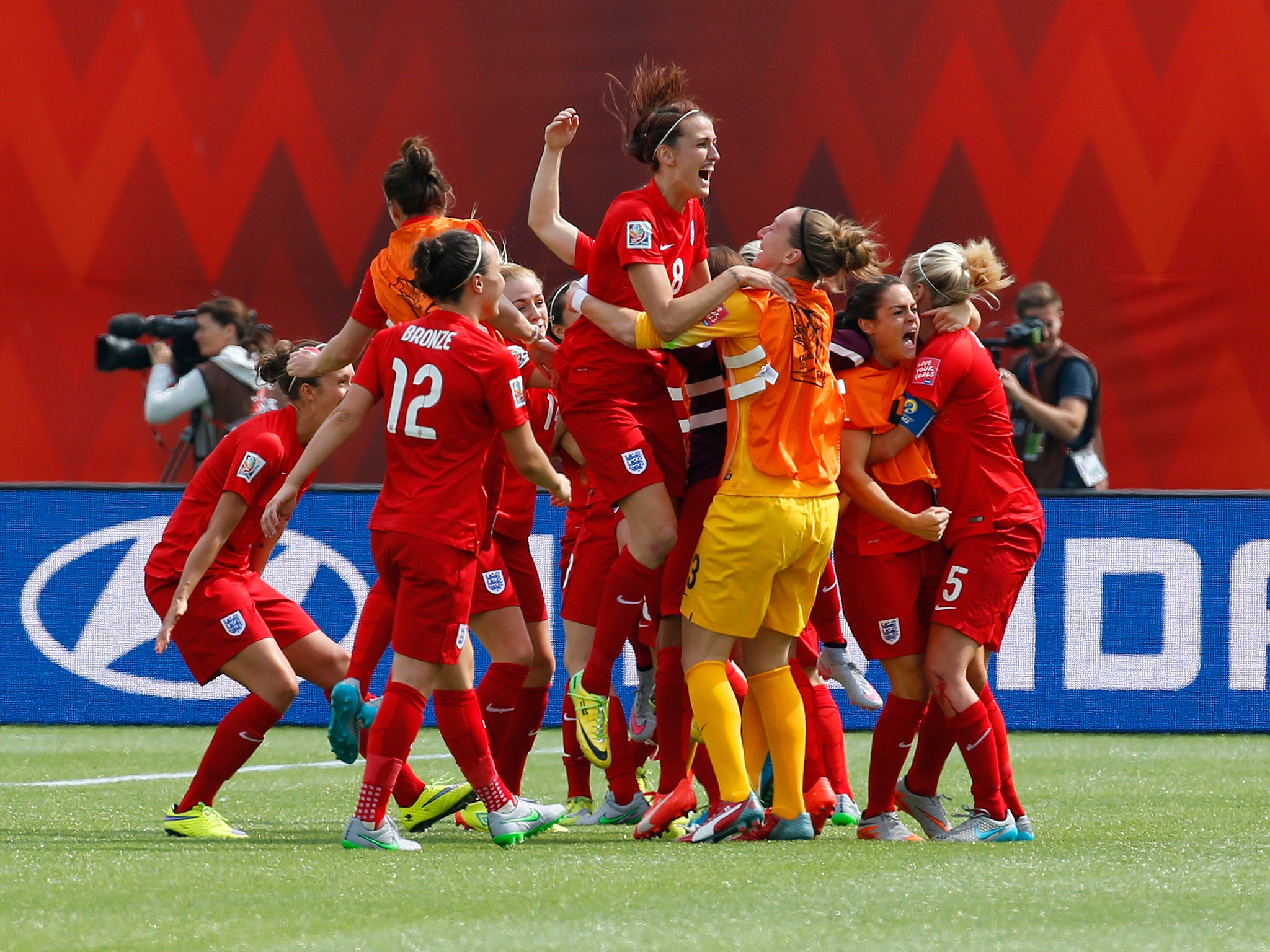 England's women celebrate after their 3rd place play-off win against Germany