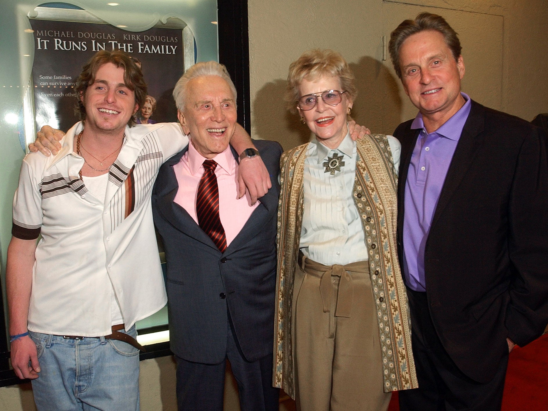 Kirk Douglas poses with his ex-wife Diana Douglas, their son Michael Douglas, and Michael's son Cameron Douglas