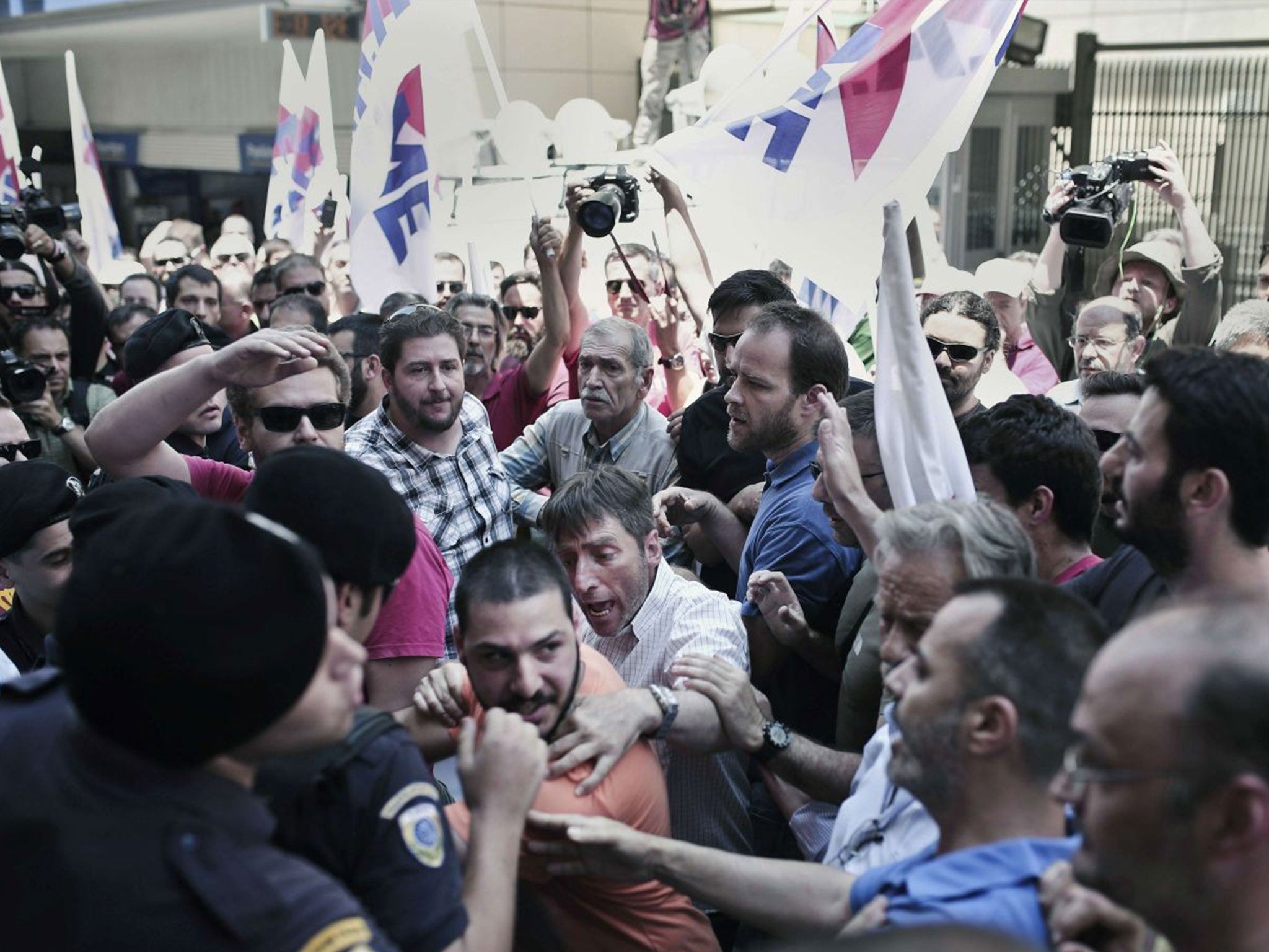 Supporters of the Greek Communist Party scuffle with police