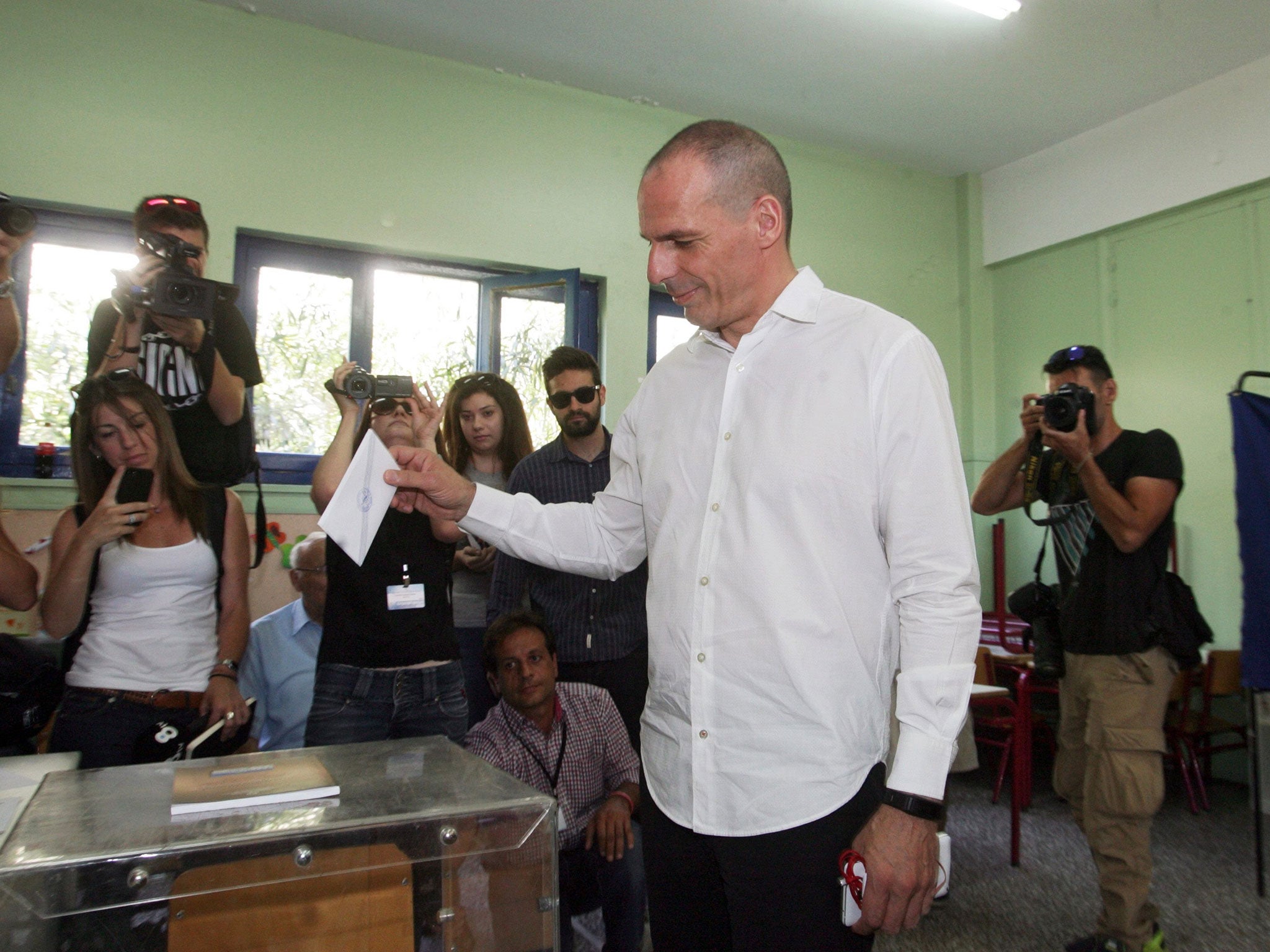 Greece's finance minister Yanis Varoufakis casts his vote in the country's referendum