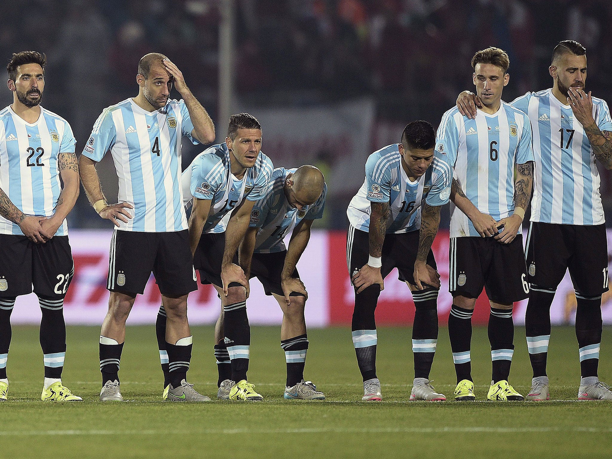 Argentina players react after losing on penalties