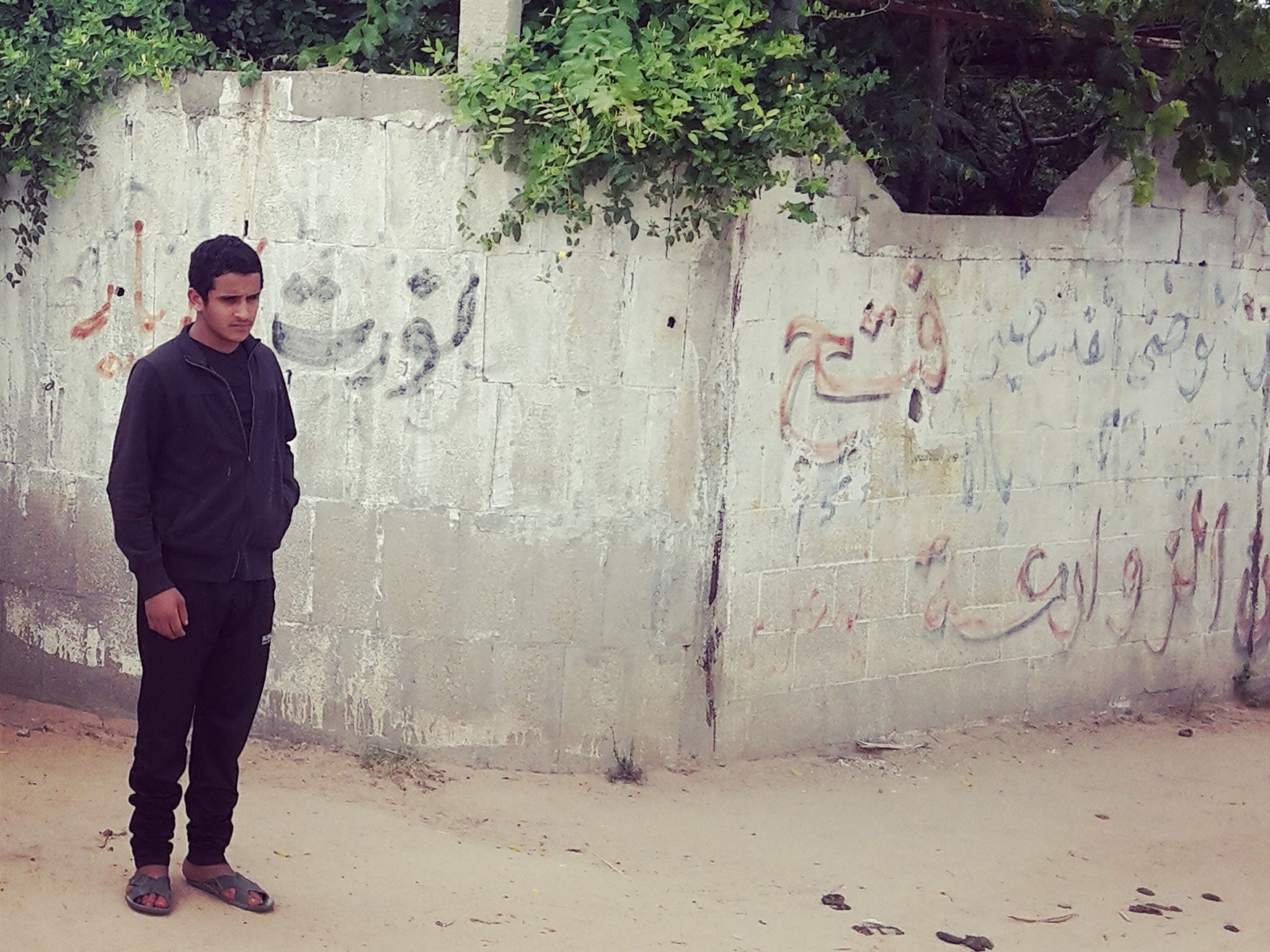 Anwar al-Zawaraa, 22, outside his home in Maghazi