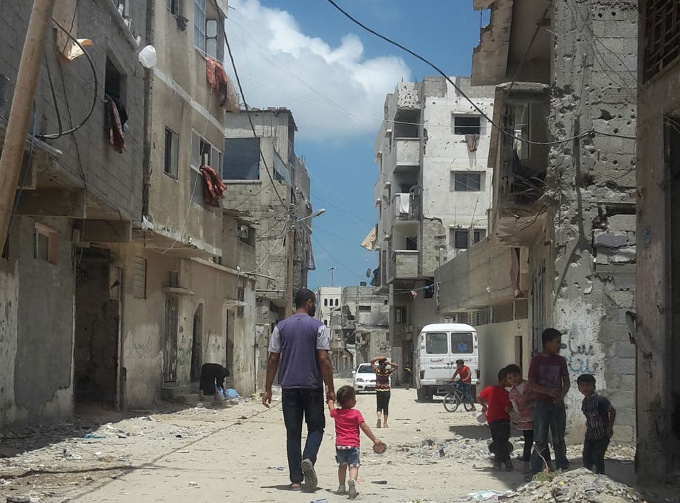 Life goes on amid the gutted buildings – bombed in the war in 2014 – in the Gaza City district of Shejaiya