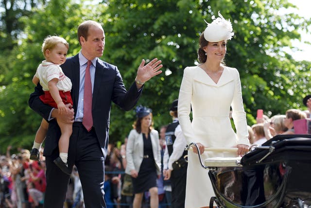 The Duke and Duchess of Cambridge walk past the crowds at the Church of St Mary Magdalene on the Sandringham Estate with their son Prince George and daughter Princess Charlotte, after her christening