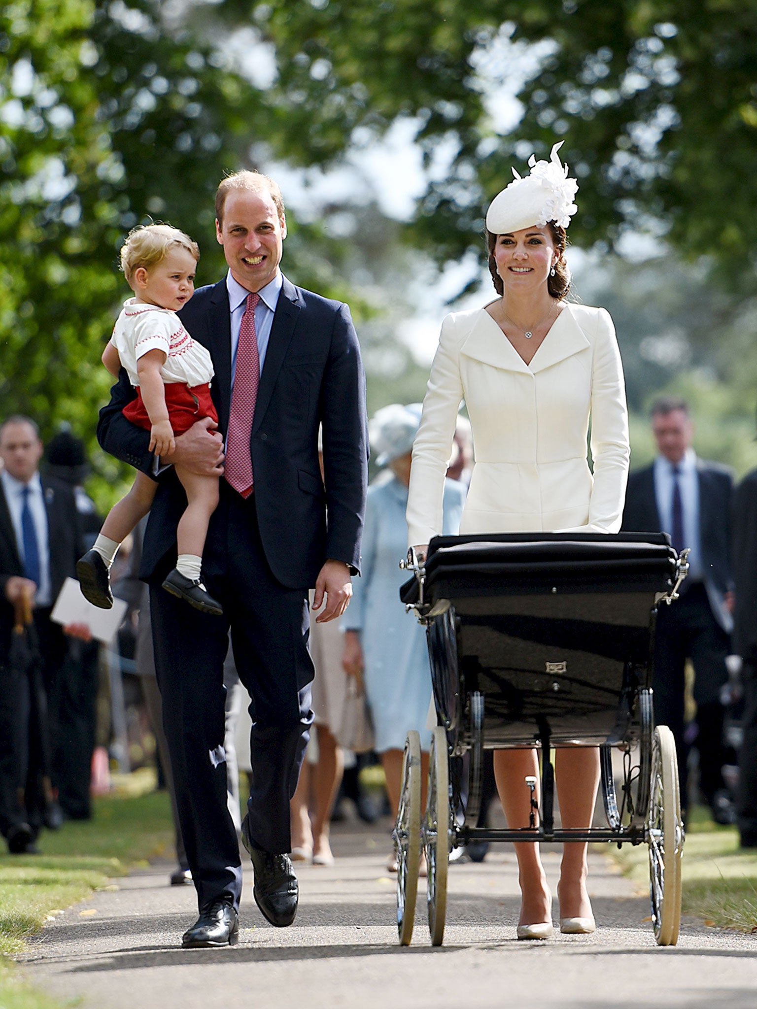 Prince William and Duchess of Cambridge, walk with their children Prince George and Princess Charlotte after the christening of Princess Charlotte at the Church of St Mary Magdalene on the Sandringham Estate