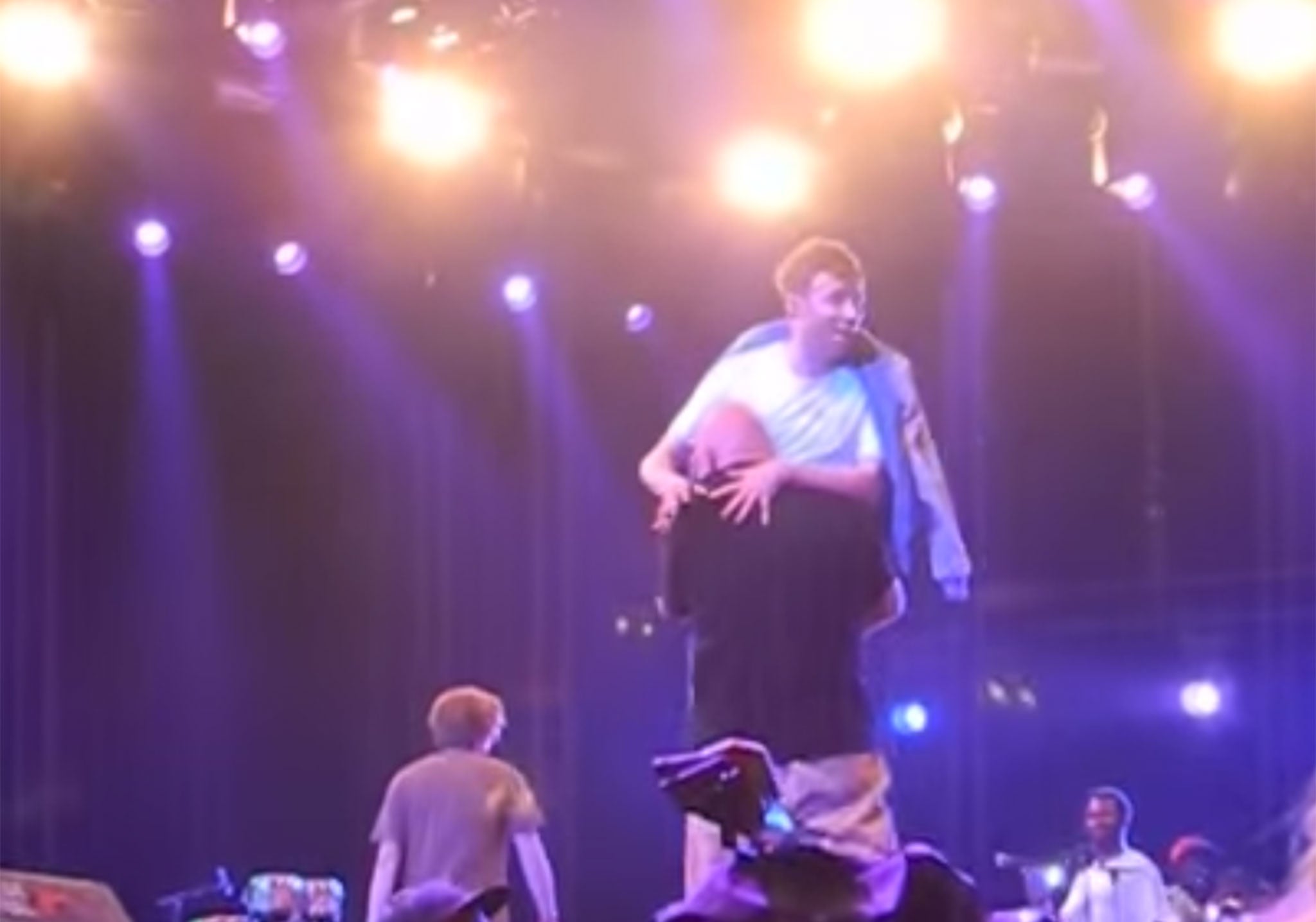 Damon Albarn being carried off stage by security at Roskilde Festival 2015