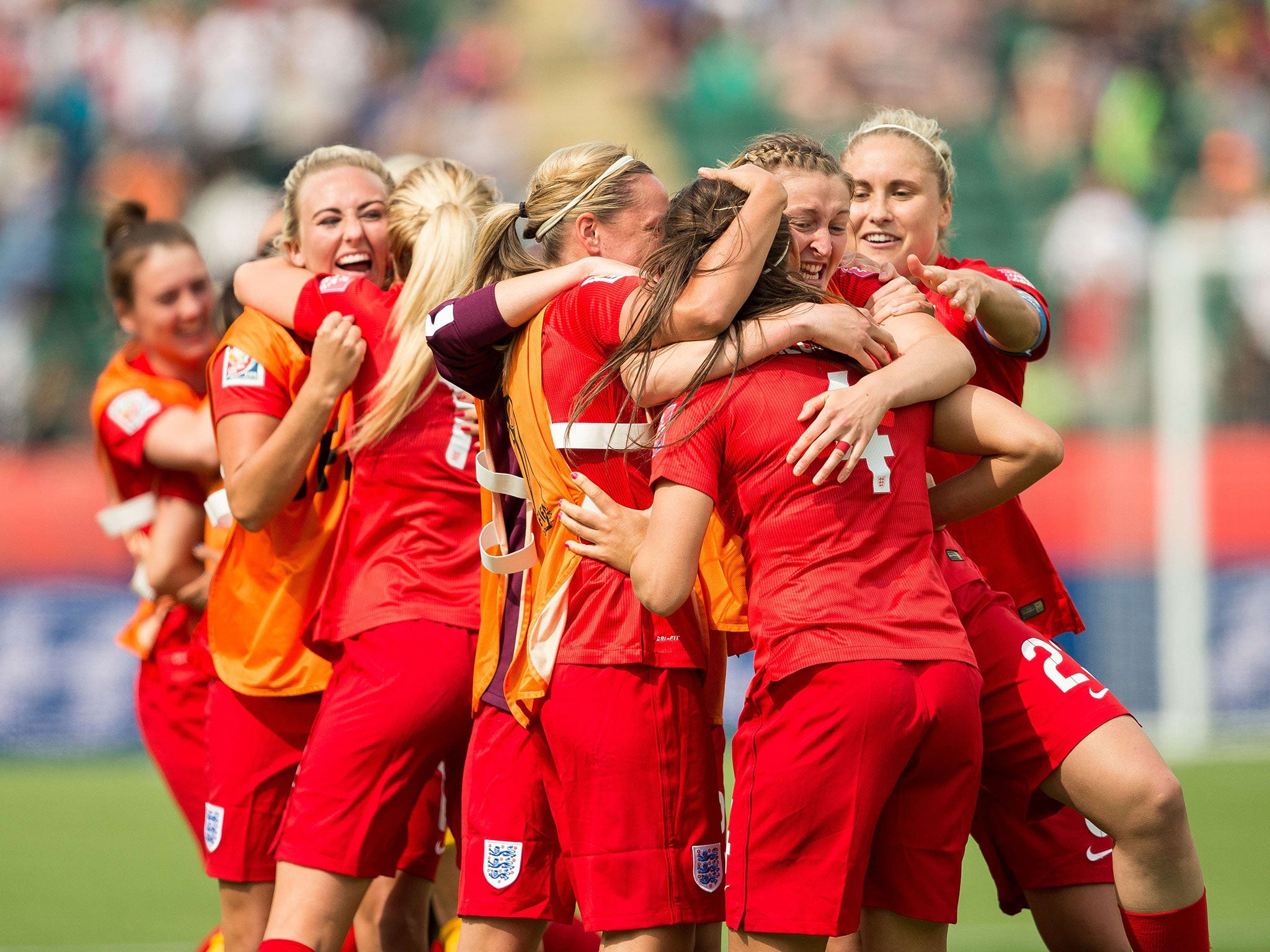 England's players celebrate Fara Williams' goal during extra time of their bronze medal match against Germany at the FIFA Women's World Cup in Edmonton, Alberta