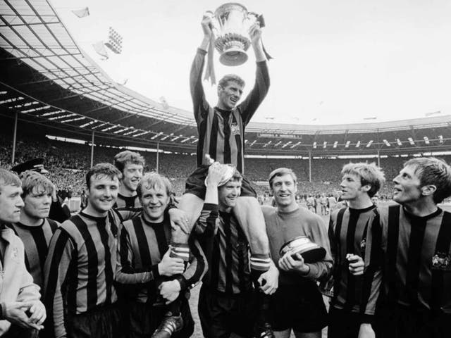 Dowd, holding the trophy base,with the Manchester City side after their win against Leicester City in the 1969 FA Cup final