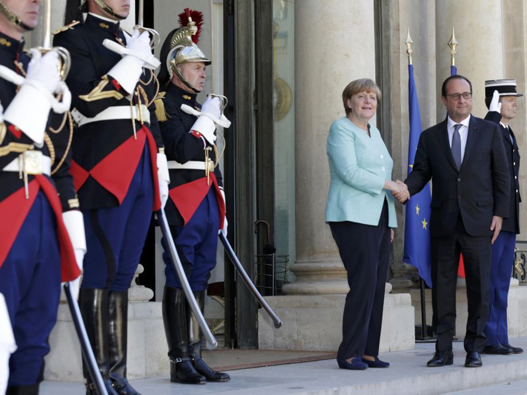 François Hollande with Angela Merkel at the Elysee Palace in Paris on Monday