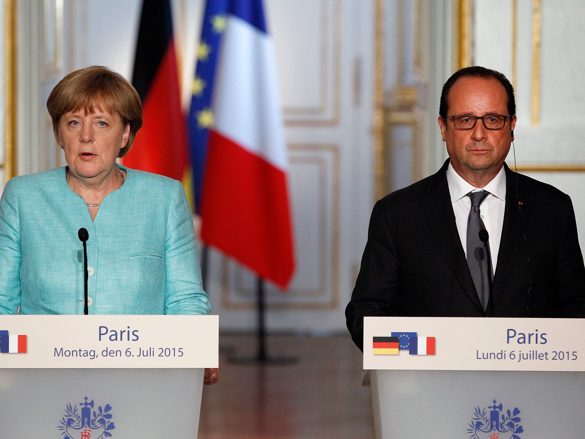 French President Francois Hollande and German Chancellor Angela Merkel during a press conference after their meeting at the Elysee Palace. The two leaders met to discuss the situation concerning the Greece in the European Union
