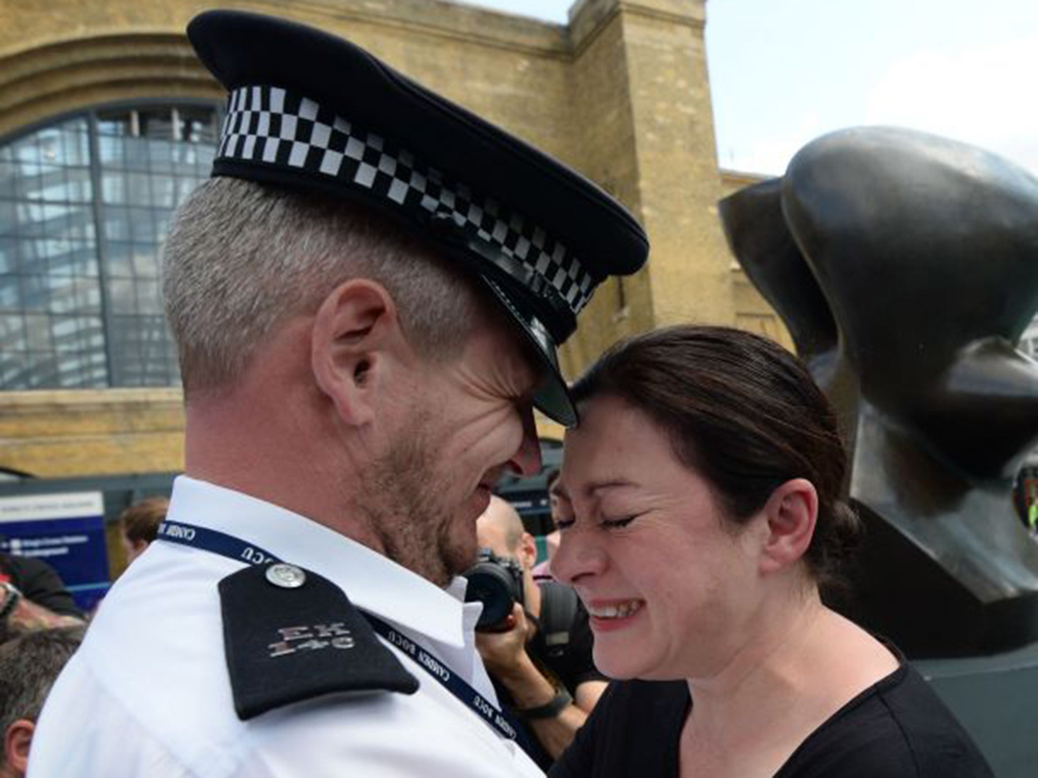 Gill Hicks with her rescuer, PC Andy Maxwell, outside King’s Cross station on Monday