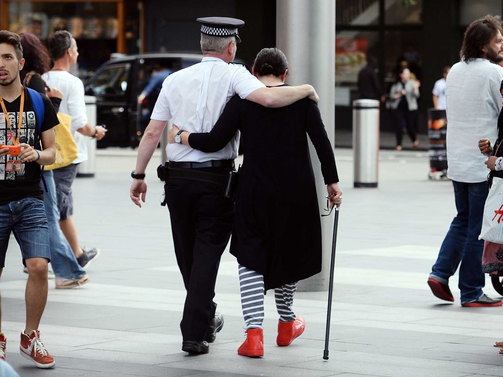 7/7 survivor Gill Hicks hugs PC Andy Maxwell, who came to her aid when she was injured at Kings Cross Station in London