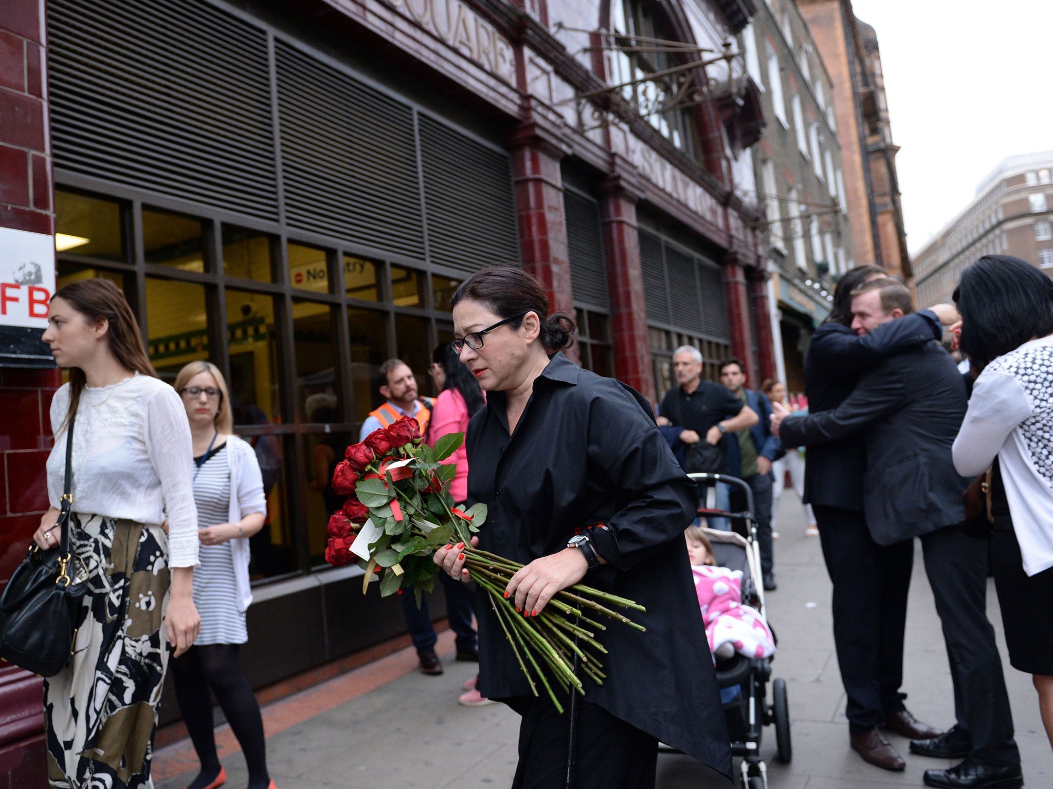 7/7 survivor Gill Hicks (centre) arrives with flowers at Russell Square tube station