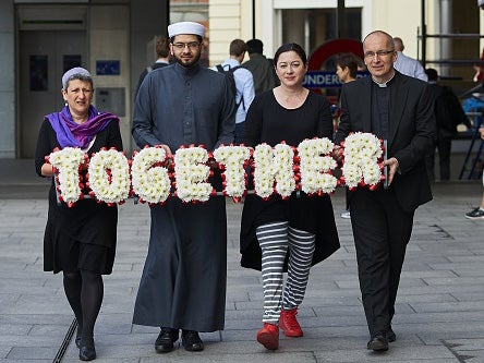 Rabbi Laura Janner-Klausner, Imam Qari Asim, 7/7 survivor Gill Hicks and Reverend Bertrand Olivier walk together to prommote religious unity before 7/7 anniversary