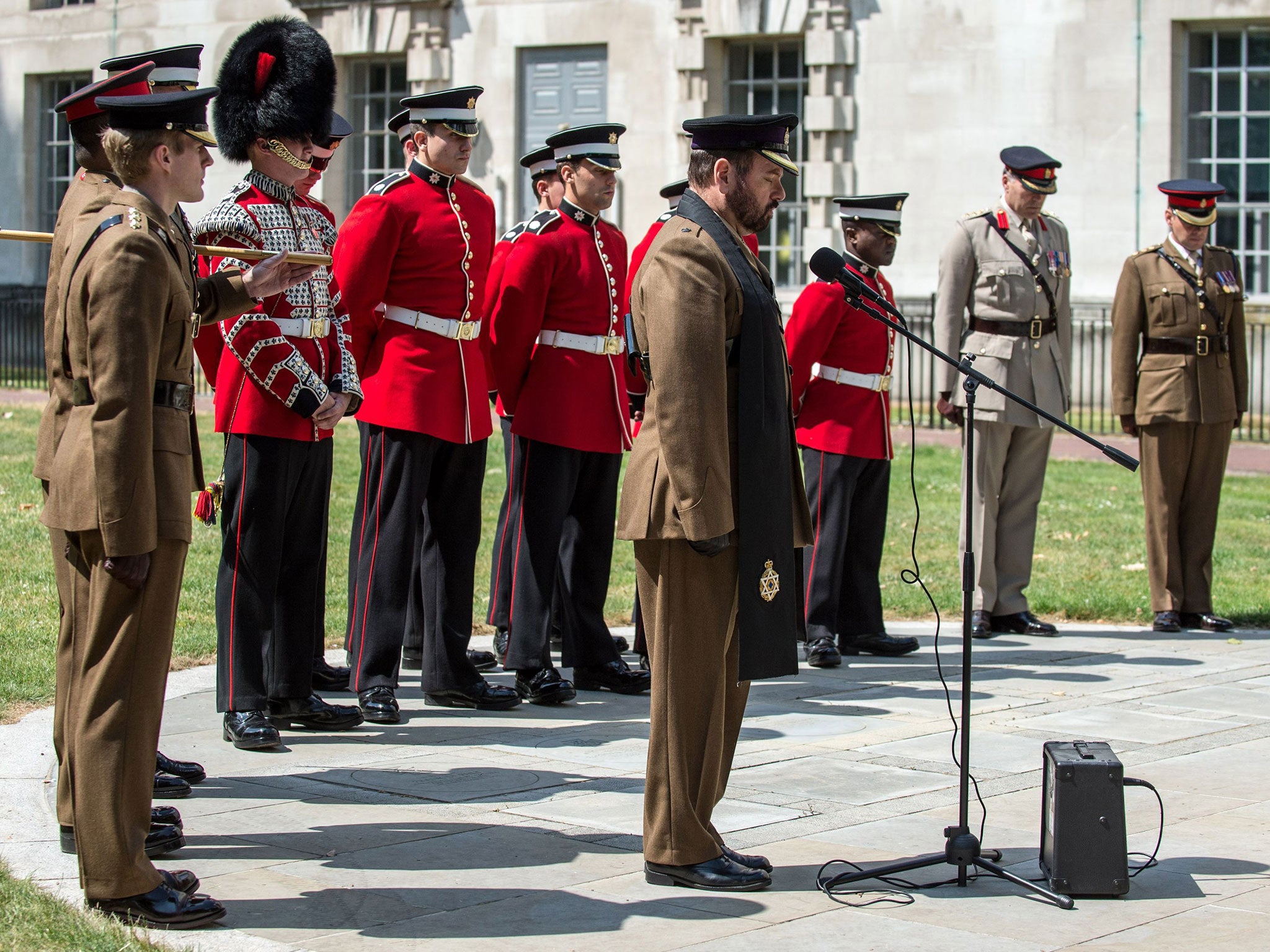 Representatives from 7 Company, Coldstream Guards and HQ London District join the national act of remembrance for the 7th July bombings 10th year anniversary beside the Ministry of Defence Main Building in central London